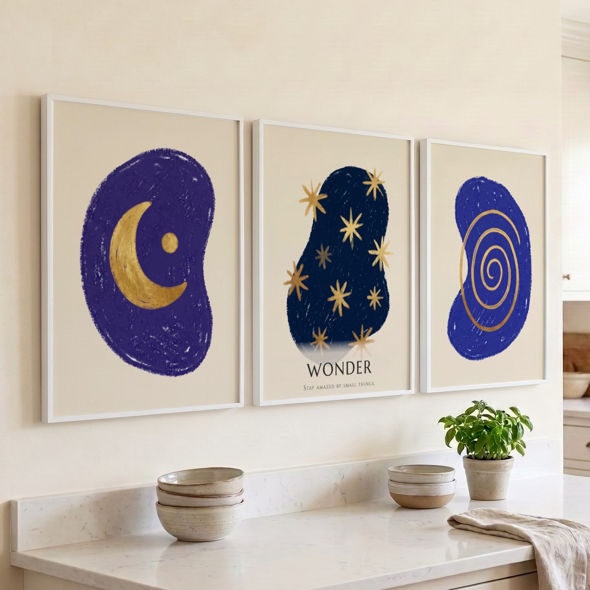 Poster triptych featuring navy blue abstract shapes with golden spiral stars and moon