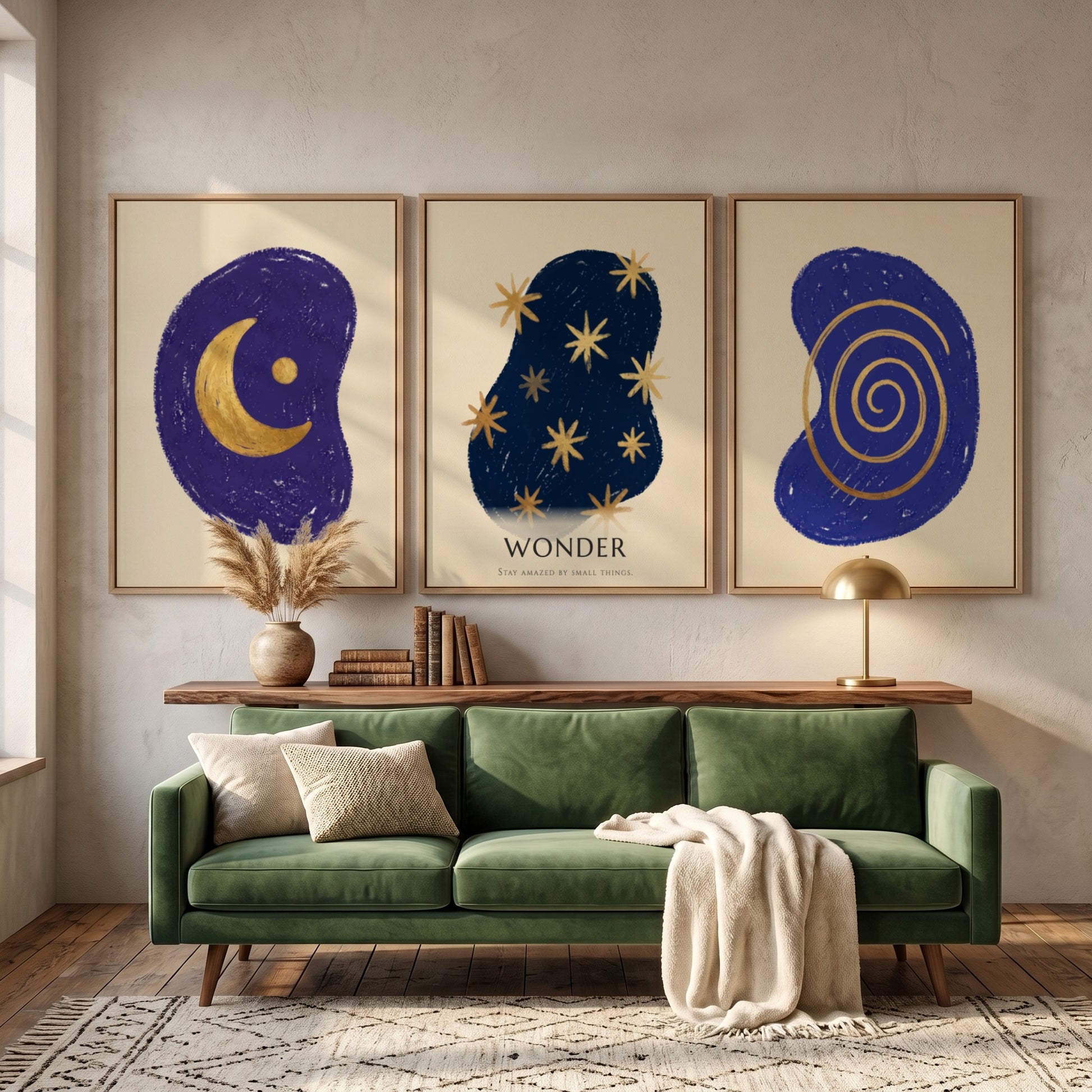 Poster triptych featuring navy blue abstract shapes with golden spiral stars and moon