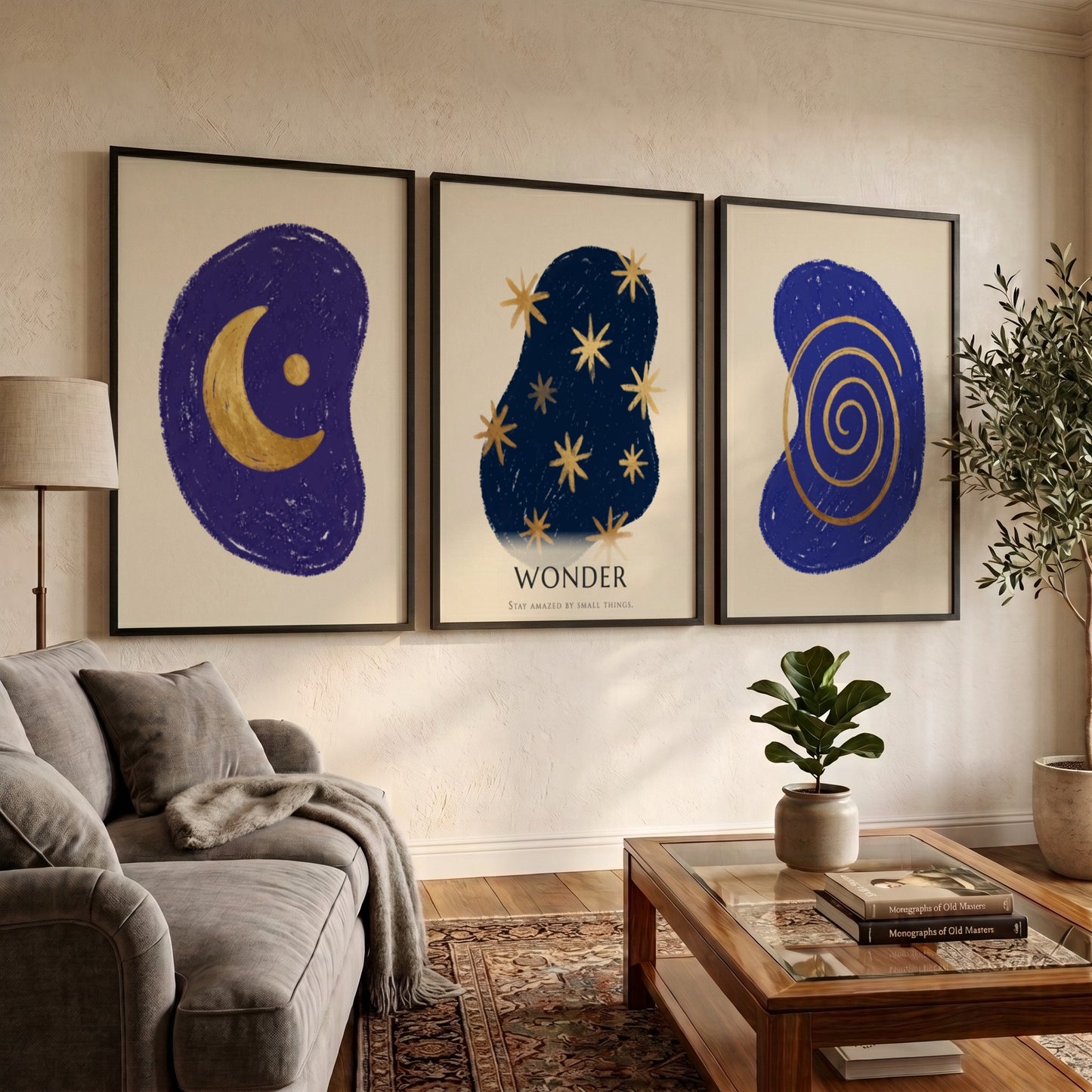 Poster triptych featuring navy blue abstract shapes with golden spiral stars and moon