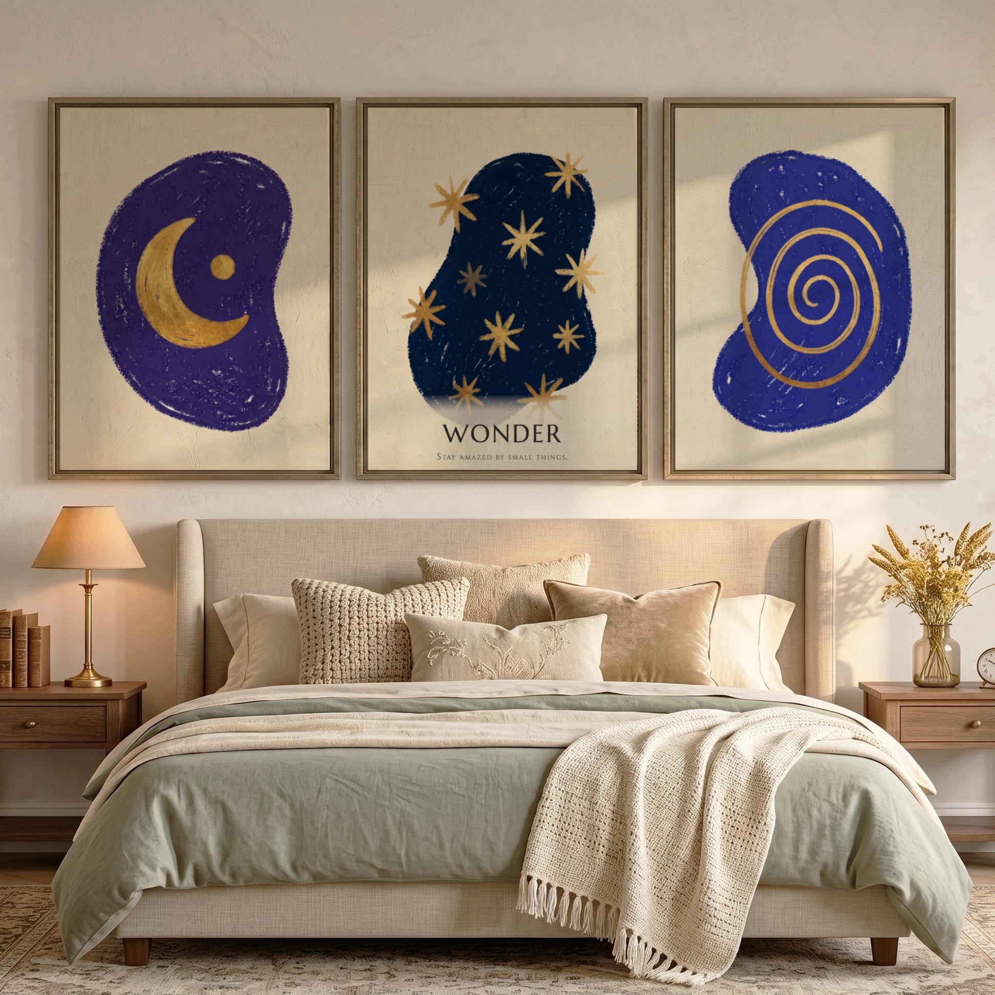 Poster triptych featuring navy blue abstract shapes with golden spiral stars and moon