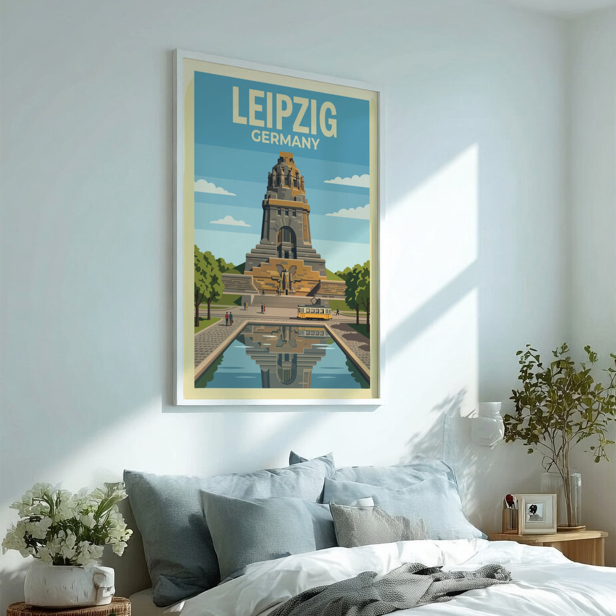 Poster of the Leipzig Germany monument with a yellow tram and water reflection.