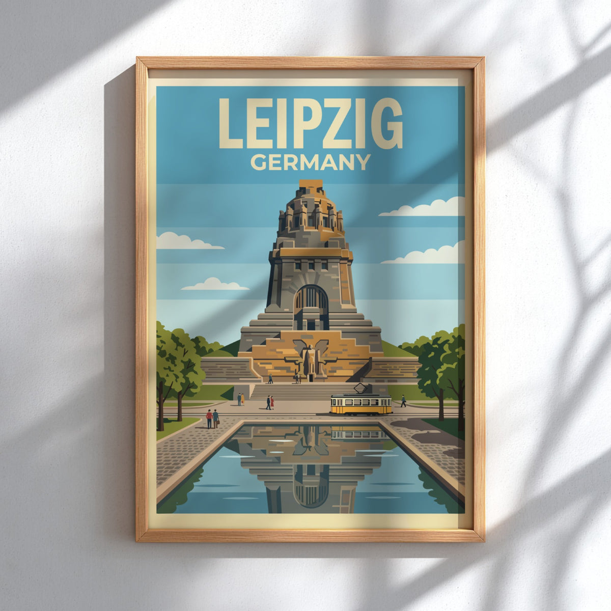 Poster of the Leipzig Germany monument with a yellow tram and water reflection.
