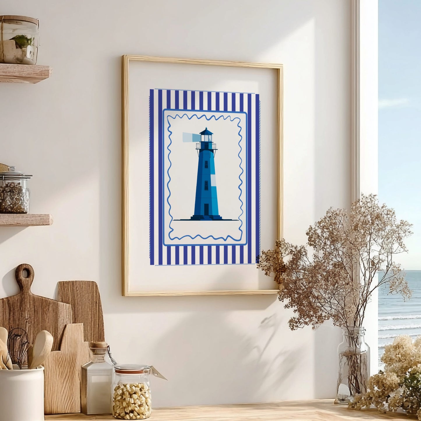 Framed artwork of a blue lighthouse with a striped border on a wall in a room with decor elements.