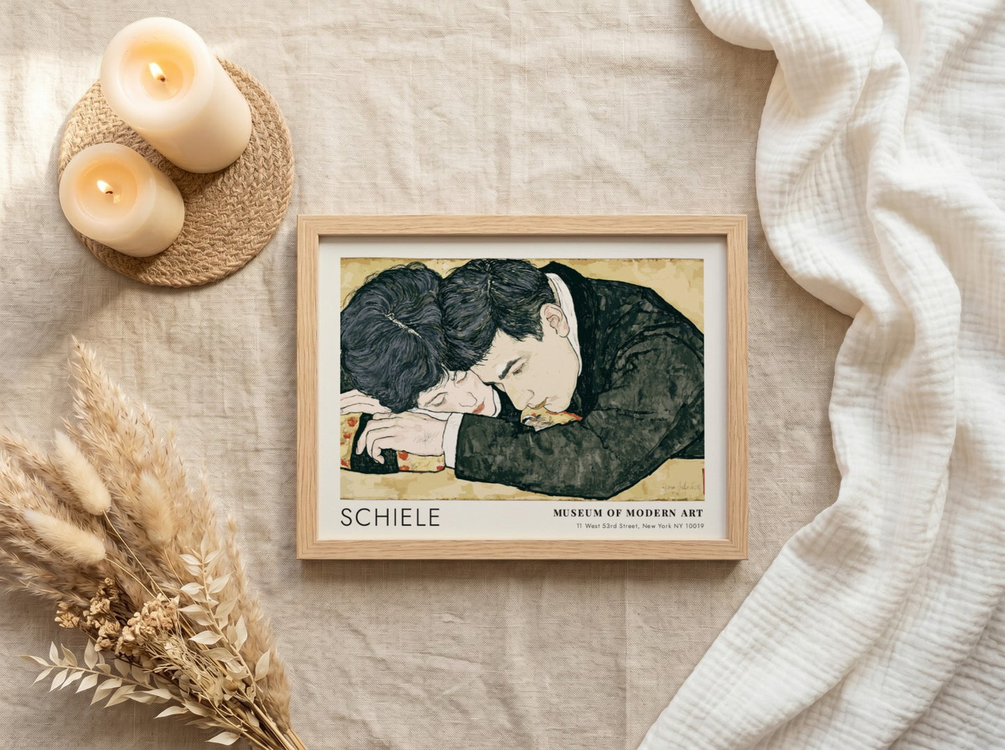 Wall art poster featuring Egon Schiele couple illustration in a wooden frame hanging