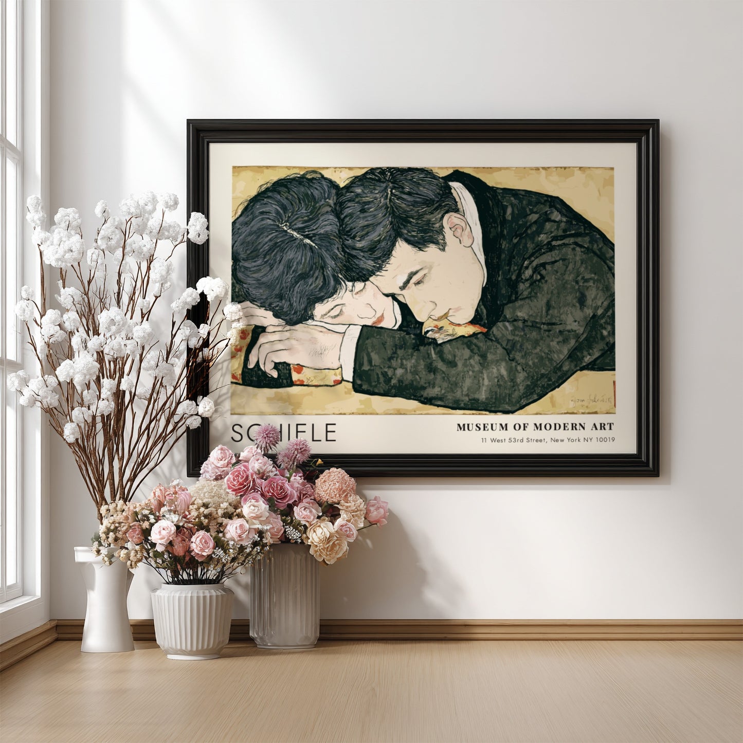 Wall art poster featuring Egon Schiele couple illustration in a wooden frame hanging
