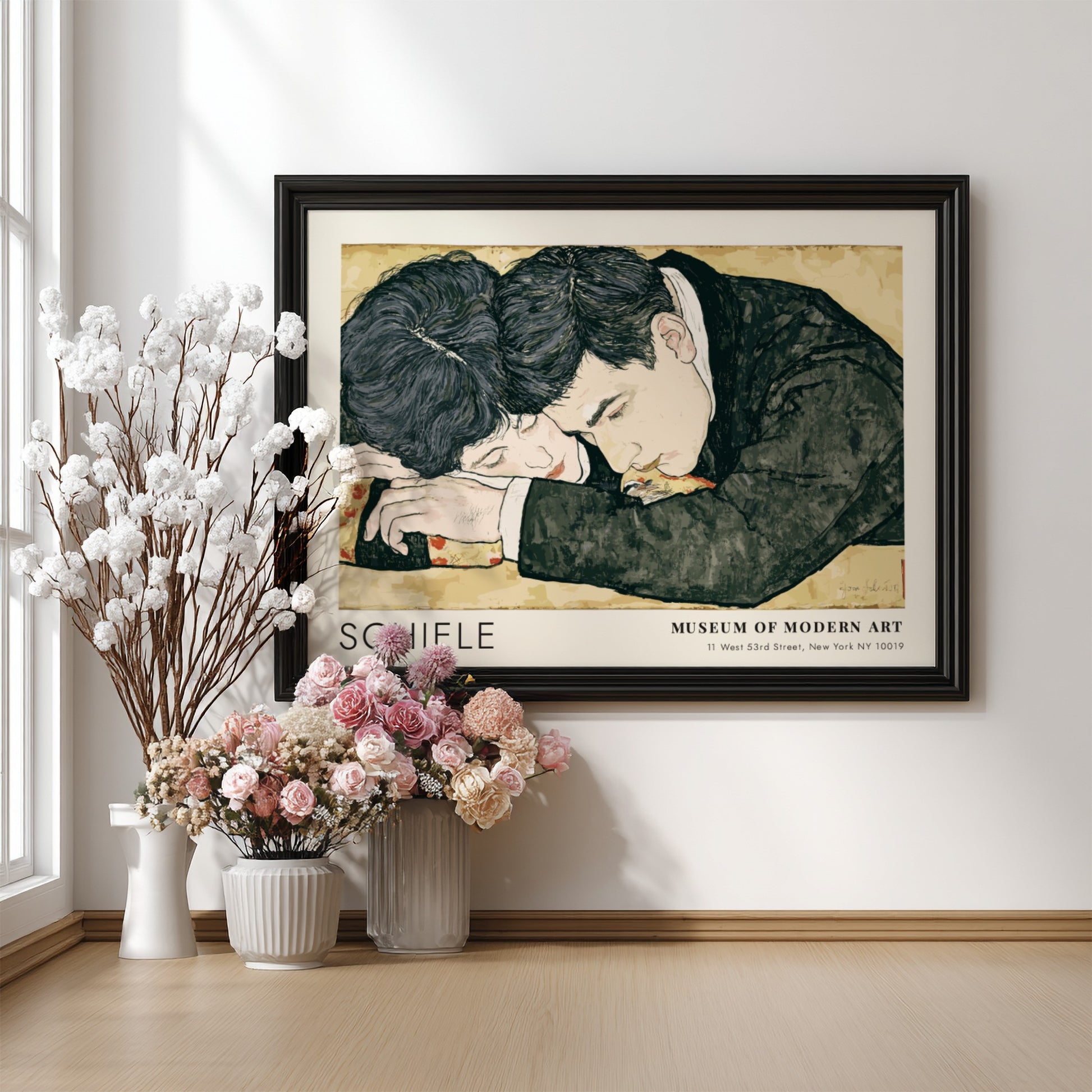 Wall art poster featuring Egon Schiele couple illustration in a wooden frame hanging