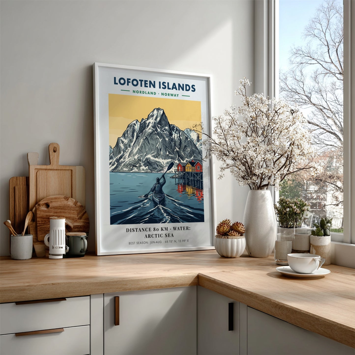 Lofoten Islands poster featuring a kayaker on Arctic water before tall snow-capped mountains.