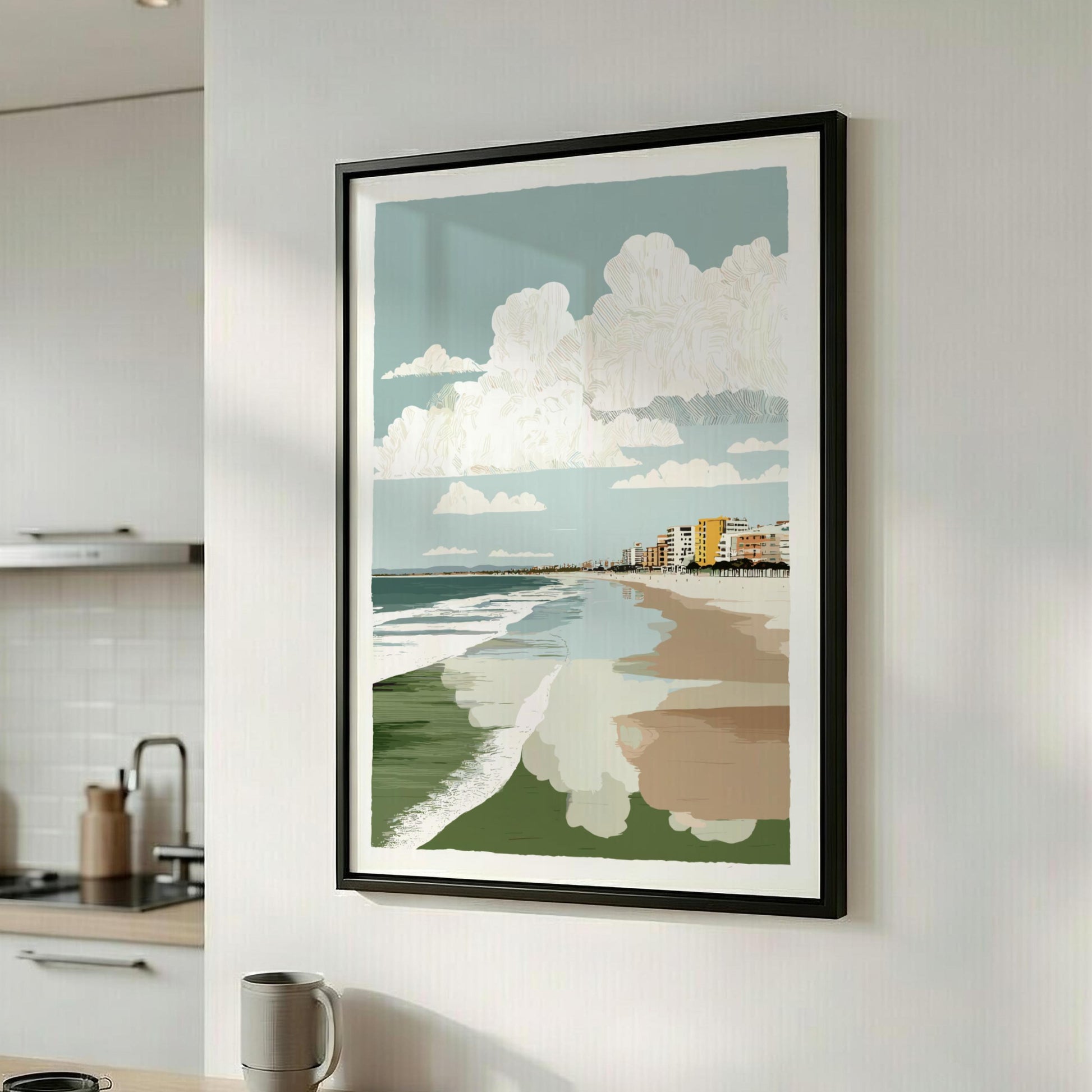 Framed beach scene print on a wall in a kitchen