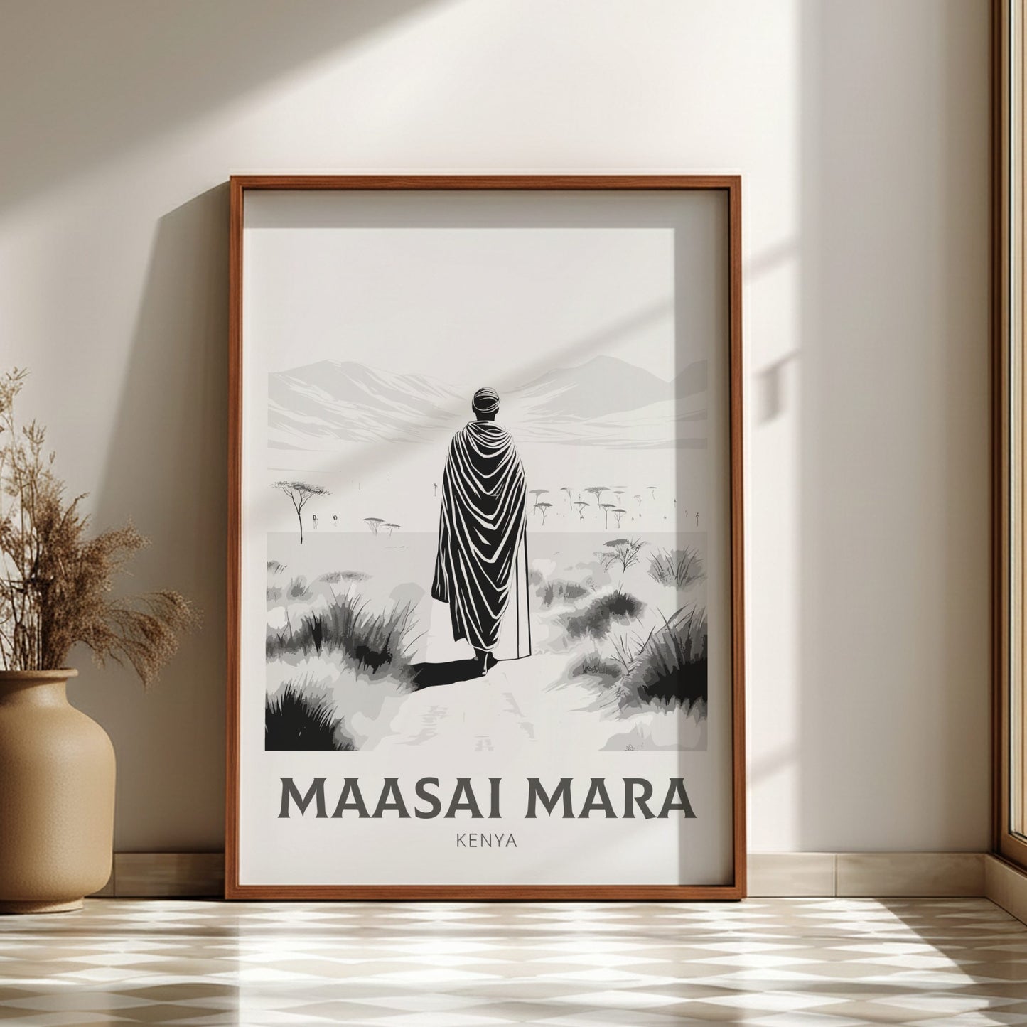 Framed print of a person in Maasai Mara, Kenya on a wall with a vase and plant decor.