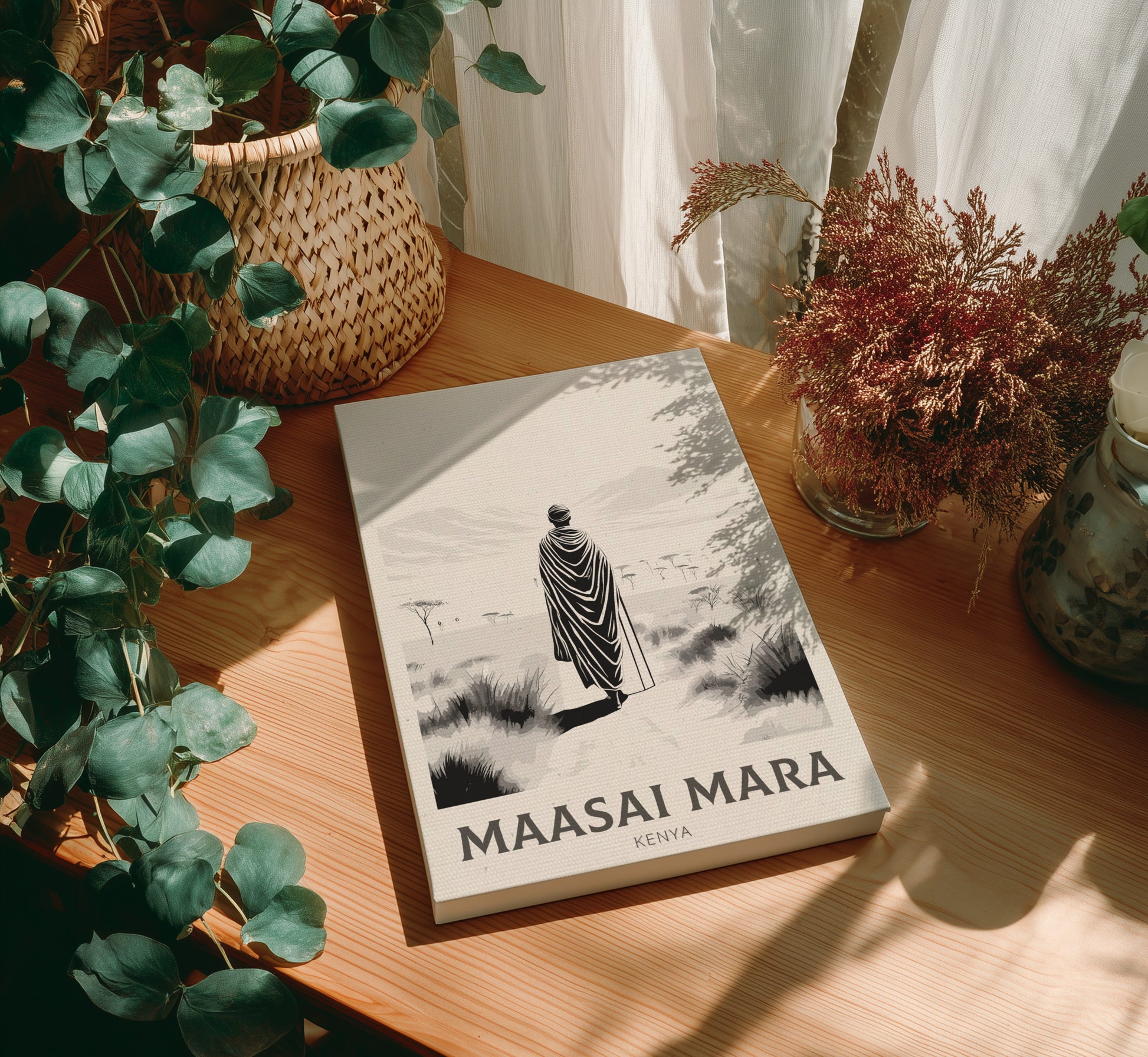 Canvas of 'Maasai Mara' on a wooden table with plants around