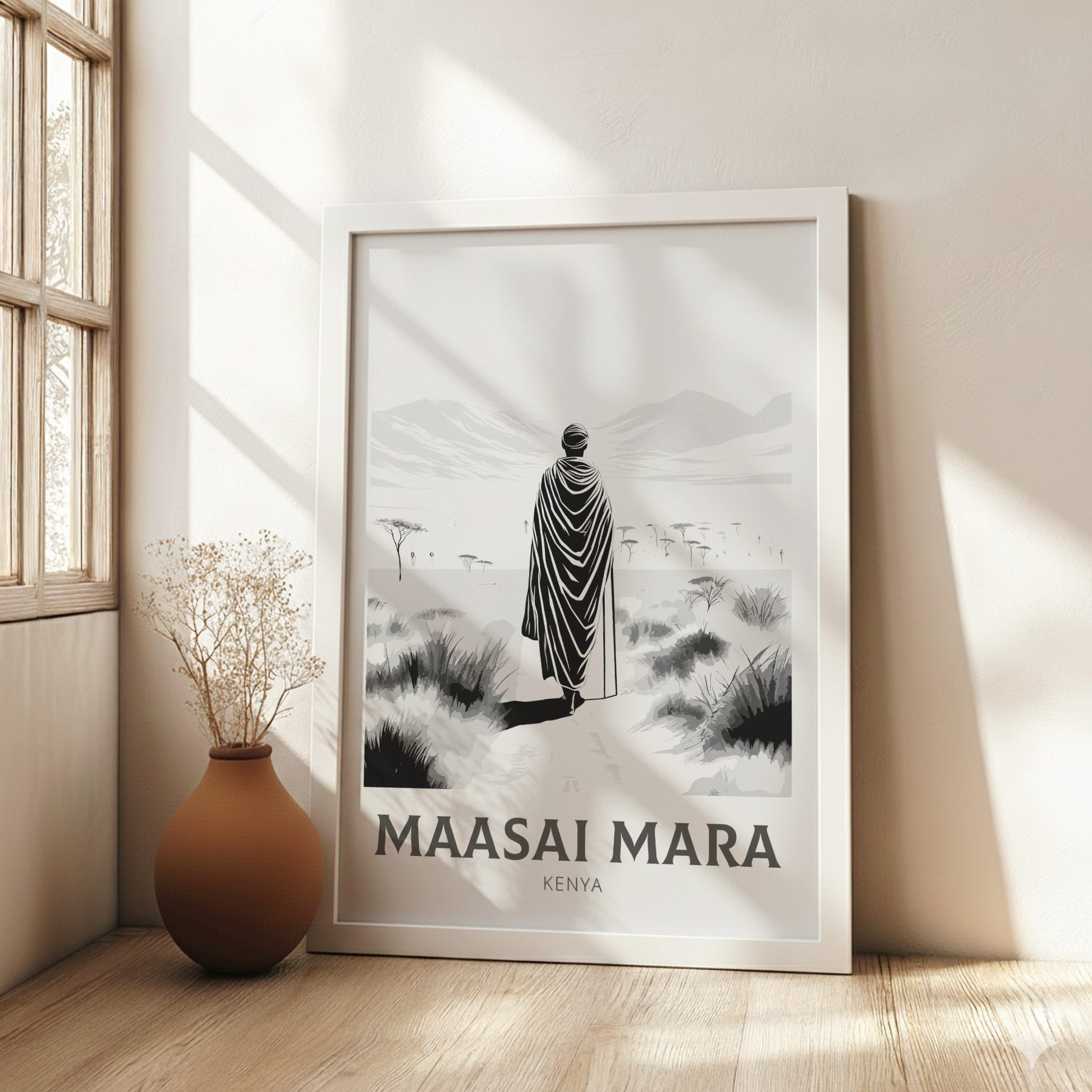 Framed poster of a person in traditional attire with 'Maasai Mara, Kenya' text in a room with natural light.