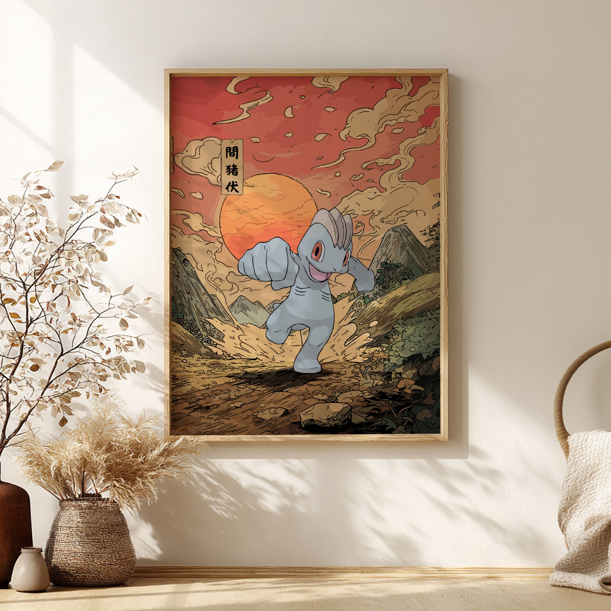 Framed artwork of Machop Pokemon in a mountainous landscape with a sunset, on a wall in a room with decor elements.