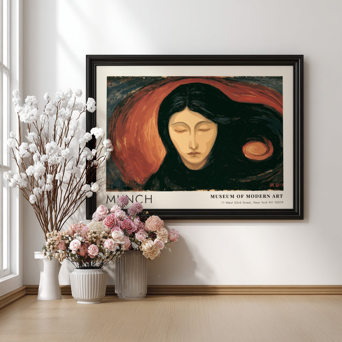 Munch Madonna exhibition poster in a light wood frame on a plain wall