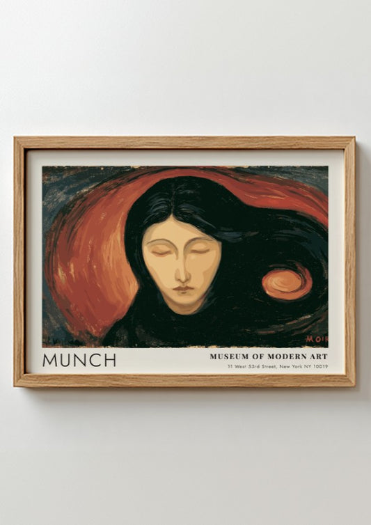 Munch Madonna exhibition poster in a light wood frame on a plain wall