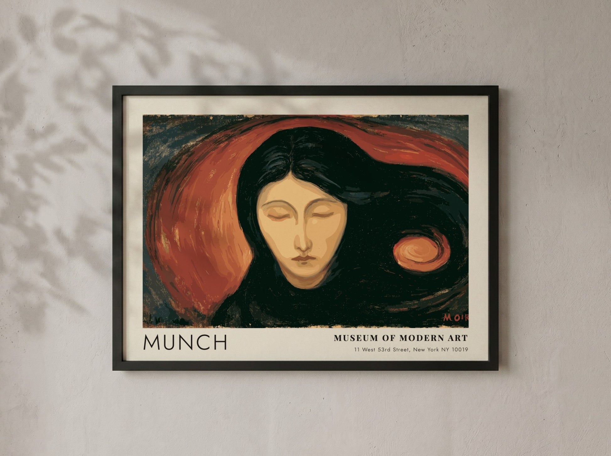 Munch Madonna exhibition poster in a light wood frame on a plain wall