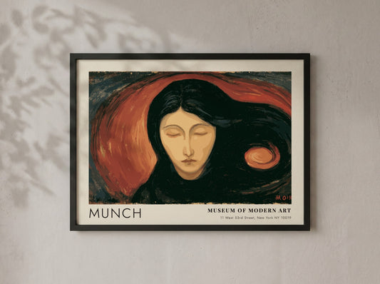 Munch Madonna exhibition poster in a light wood frame on a plain wall