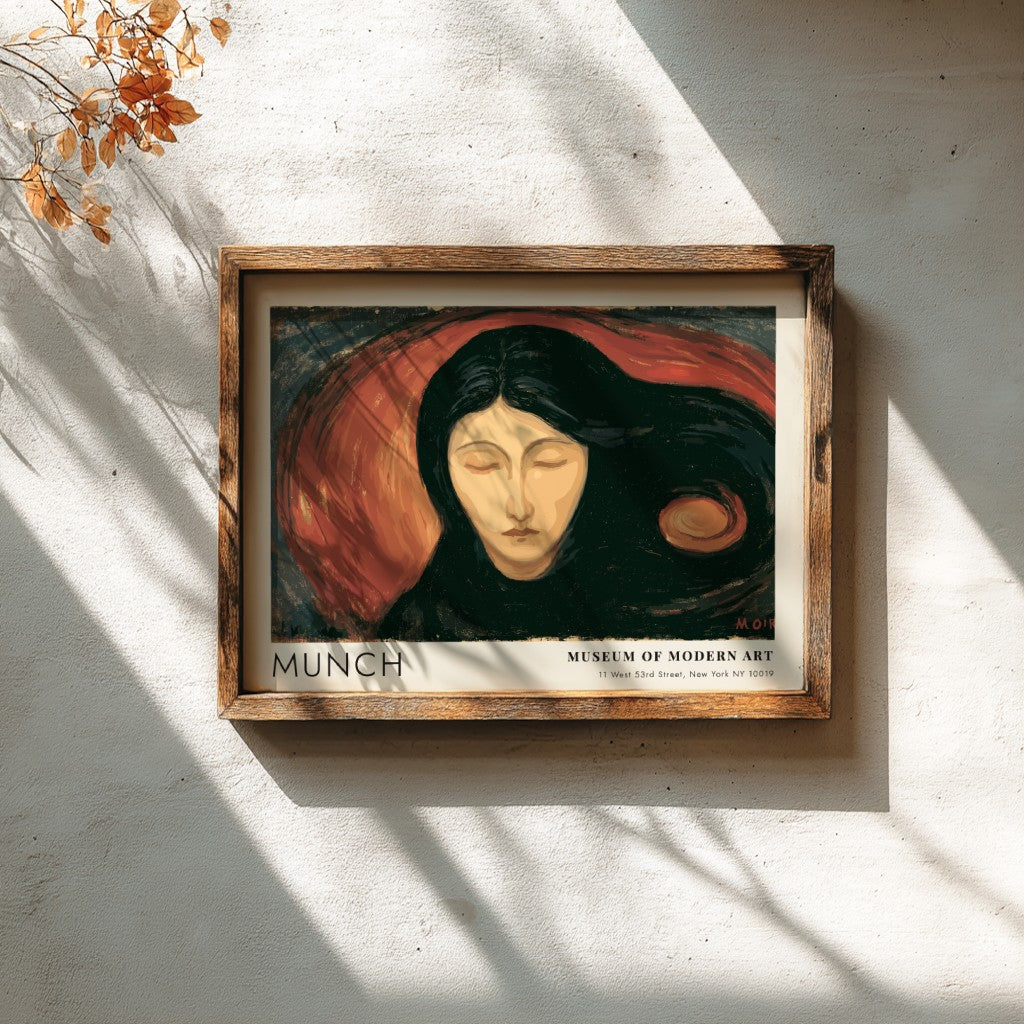 Munch Madonna exhibition poster in a light wood frame on a plain wall