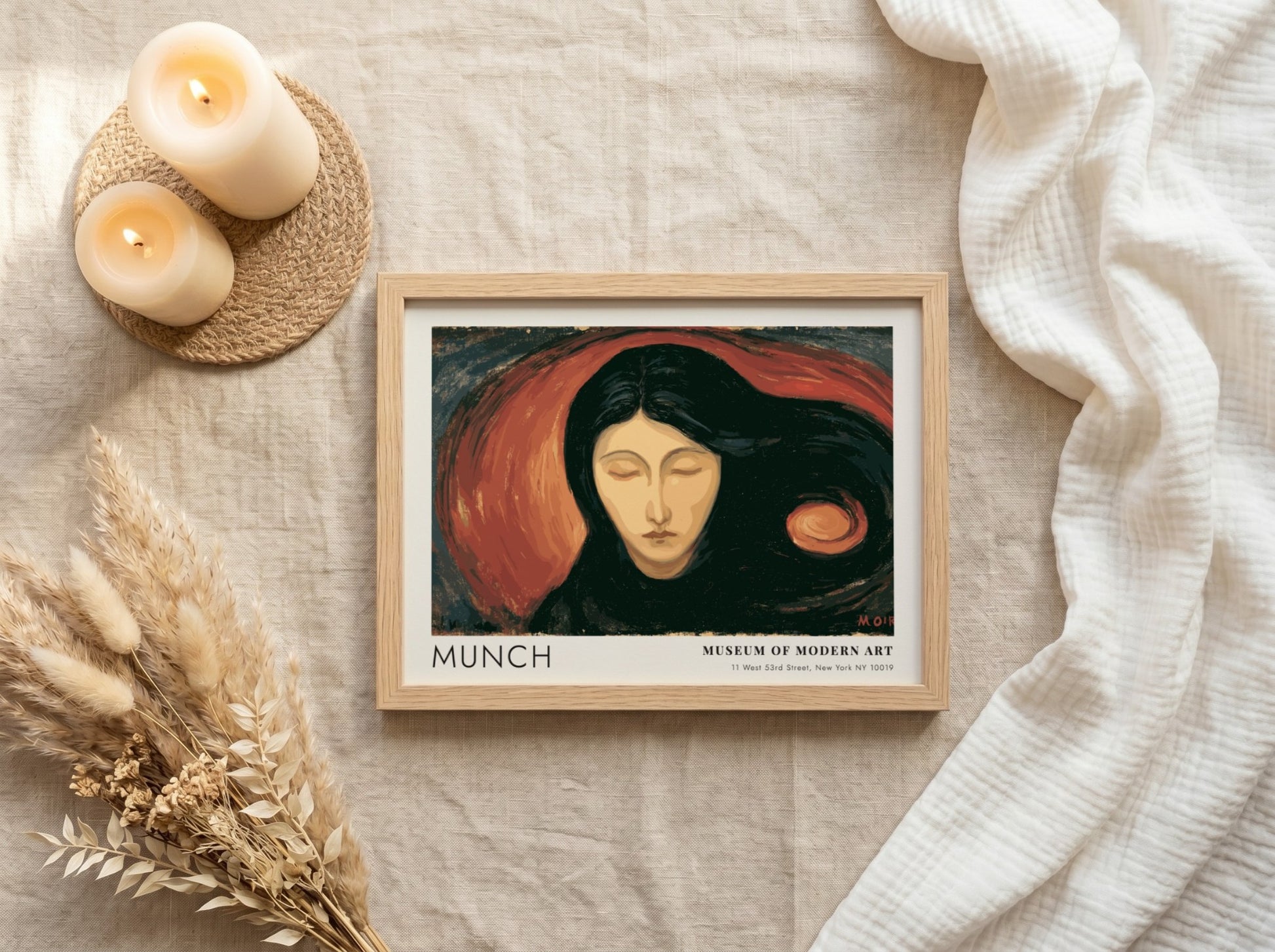Munch Madonna exhibition poster in a light wood frame on a plain wall