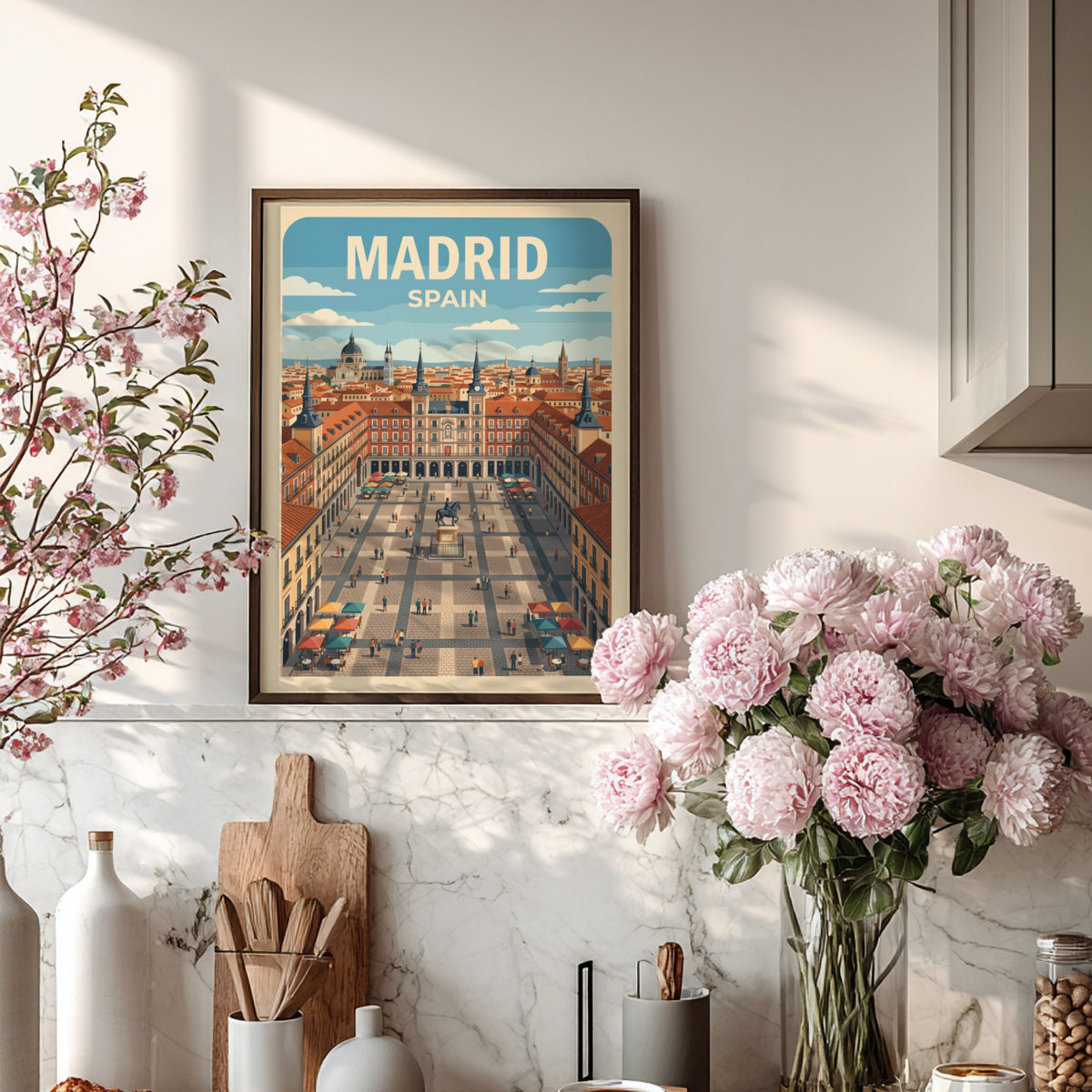 Travel poster of Madrid Spain featuring the Plaza Mayor with terracotta buildings, blue skies.