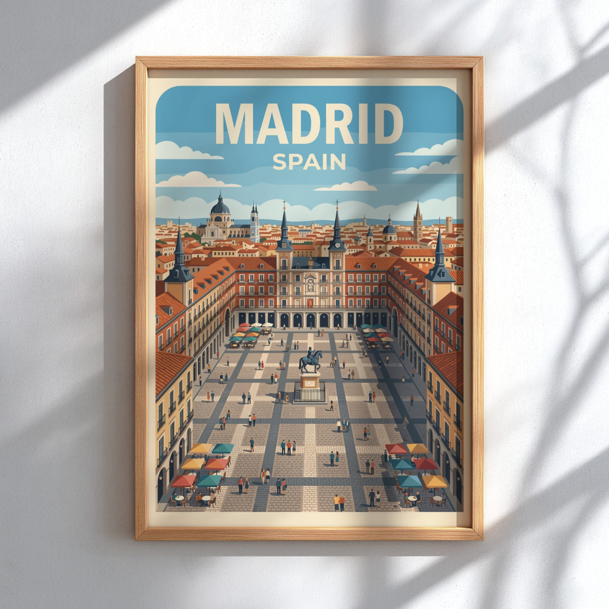 Travel poster of Madrid Spain featuring the Plaza Mayor with terracotta buildings, blue skies.