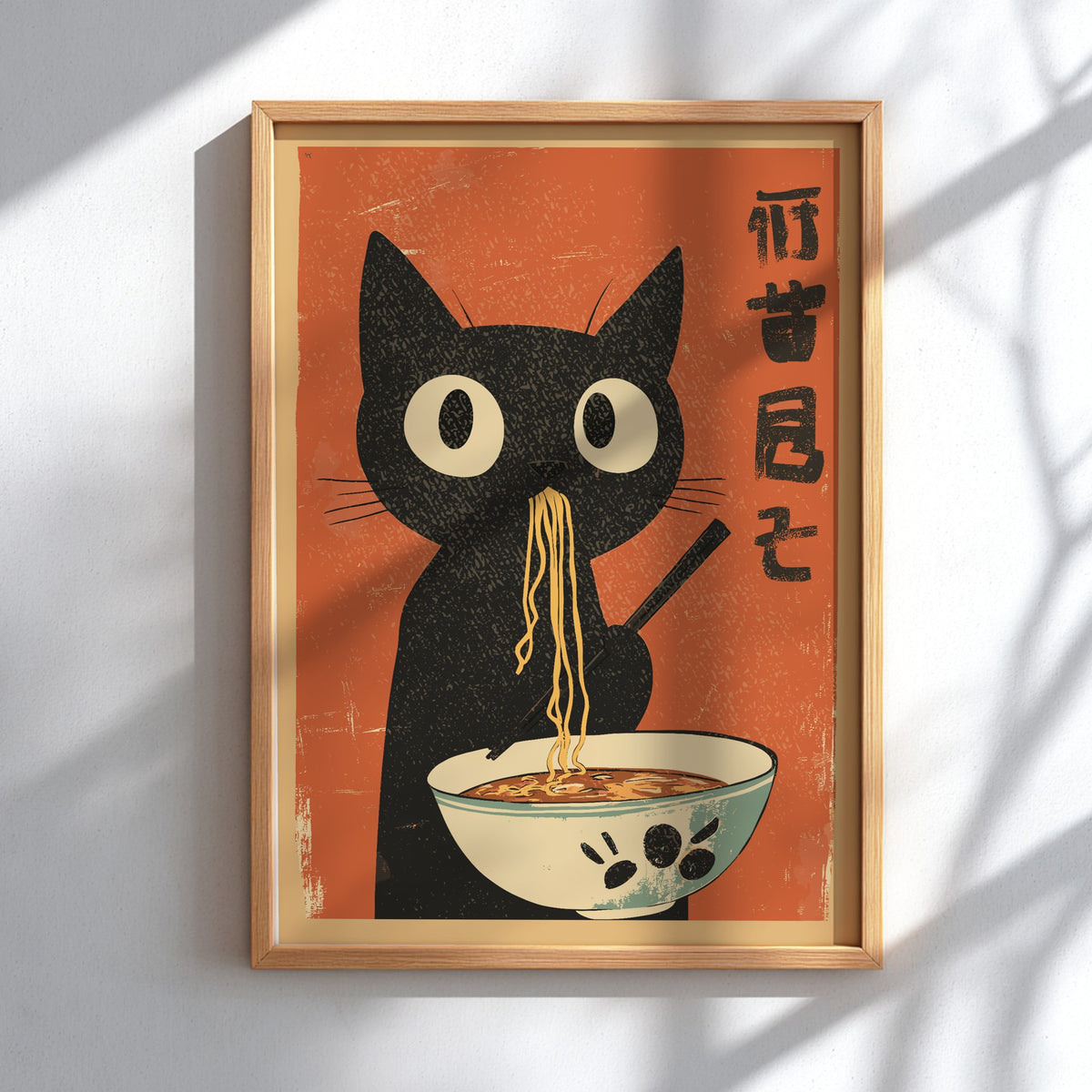 A stylized poster-style illustration of a black cat holding chopsticks and eating noodles from a bowl, set against a warm red background with black Japanese characters on the right.