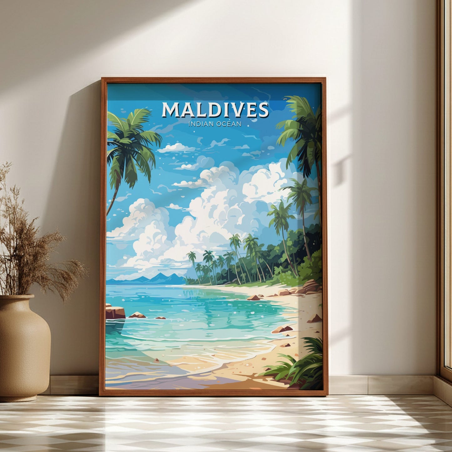 Framed artwork of the Maldives with a beach and palm trees on a wall.