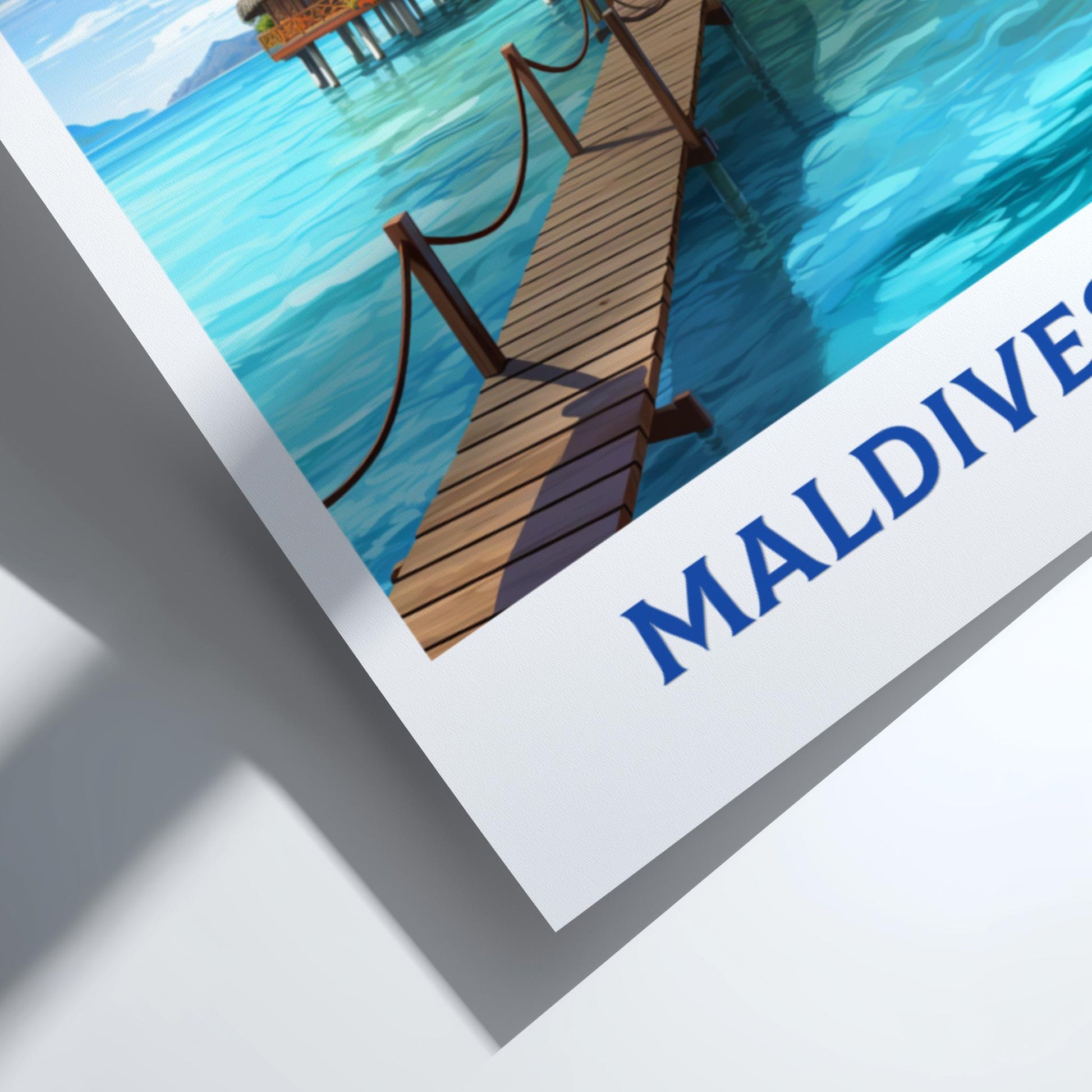 Framed artwork of a dock in the Maldives with 'MALDIVES' text.
