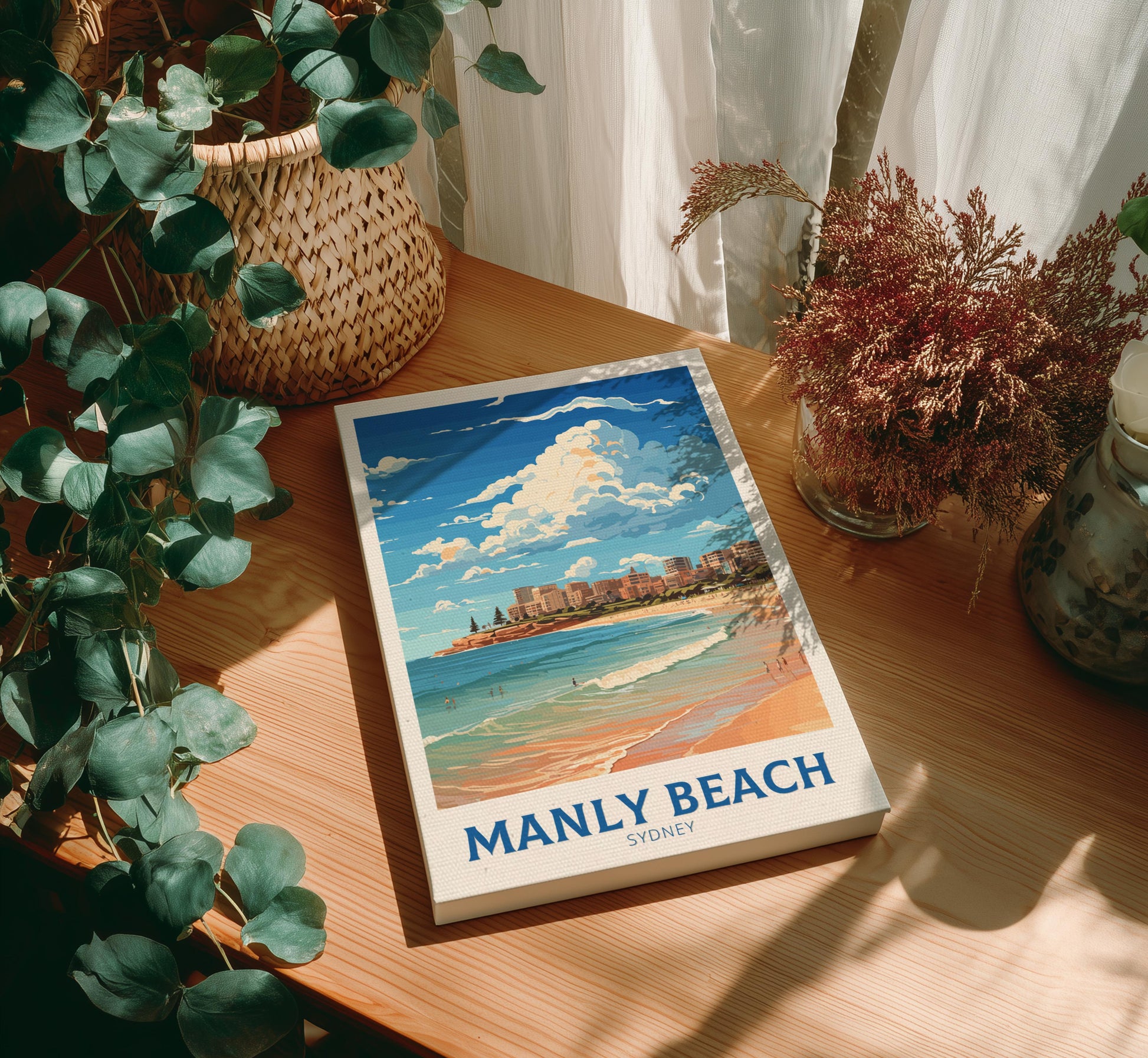 Canvas with Manly Beach illumination on a wooden table with plants