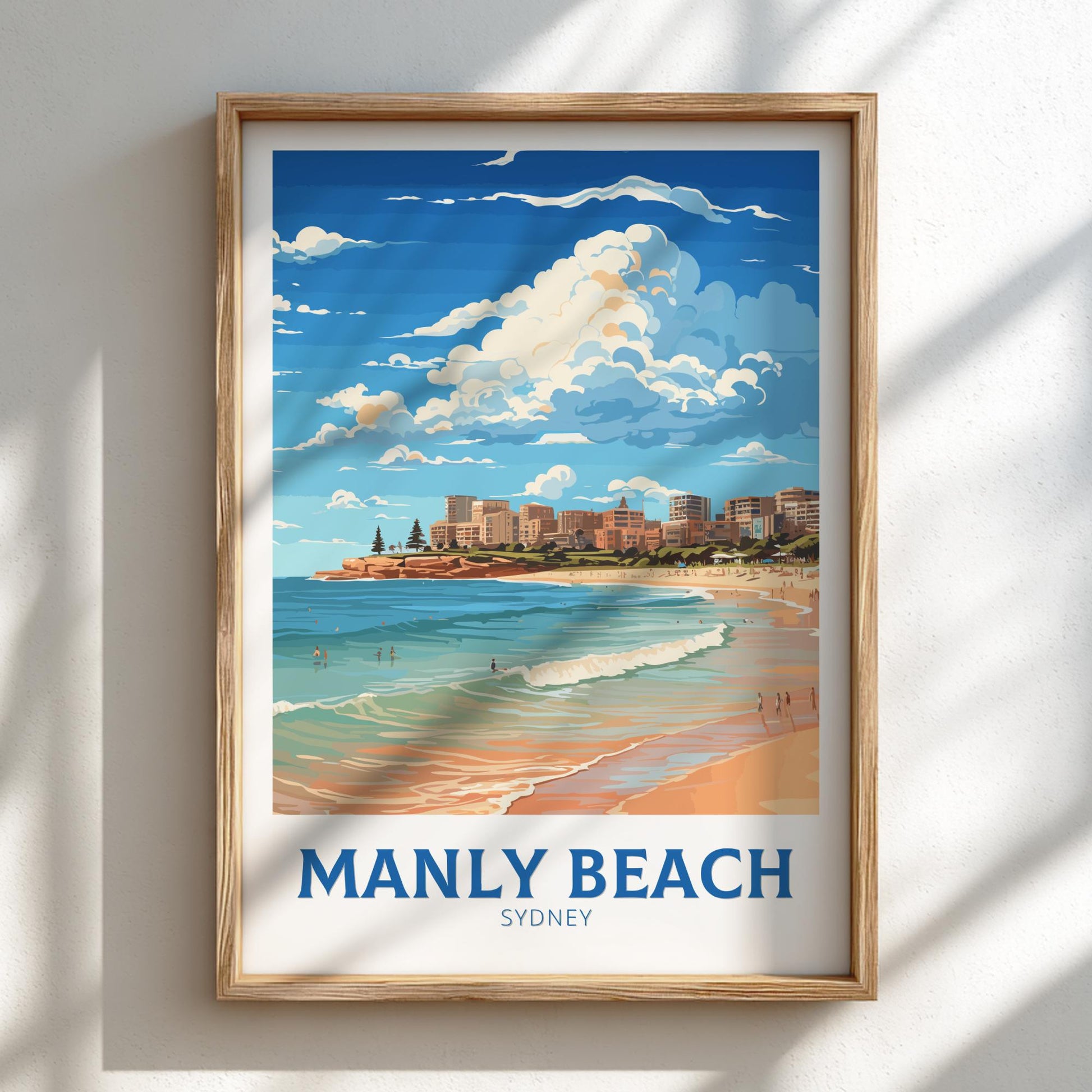 Framed artwork of Manly Beach, Sydney on a wall.
