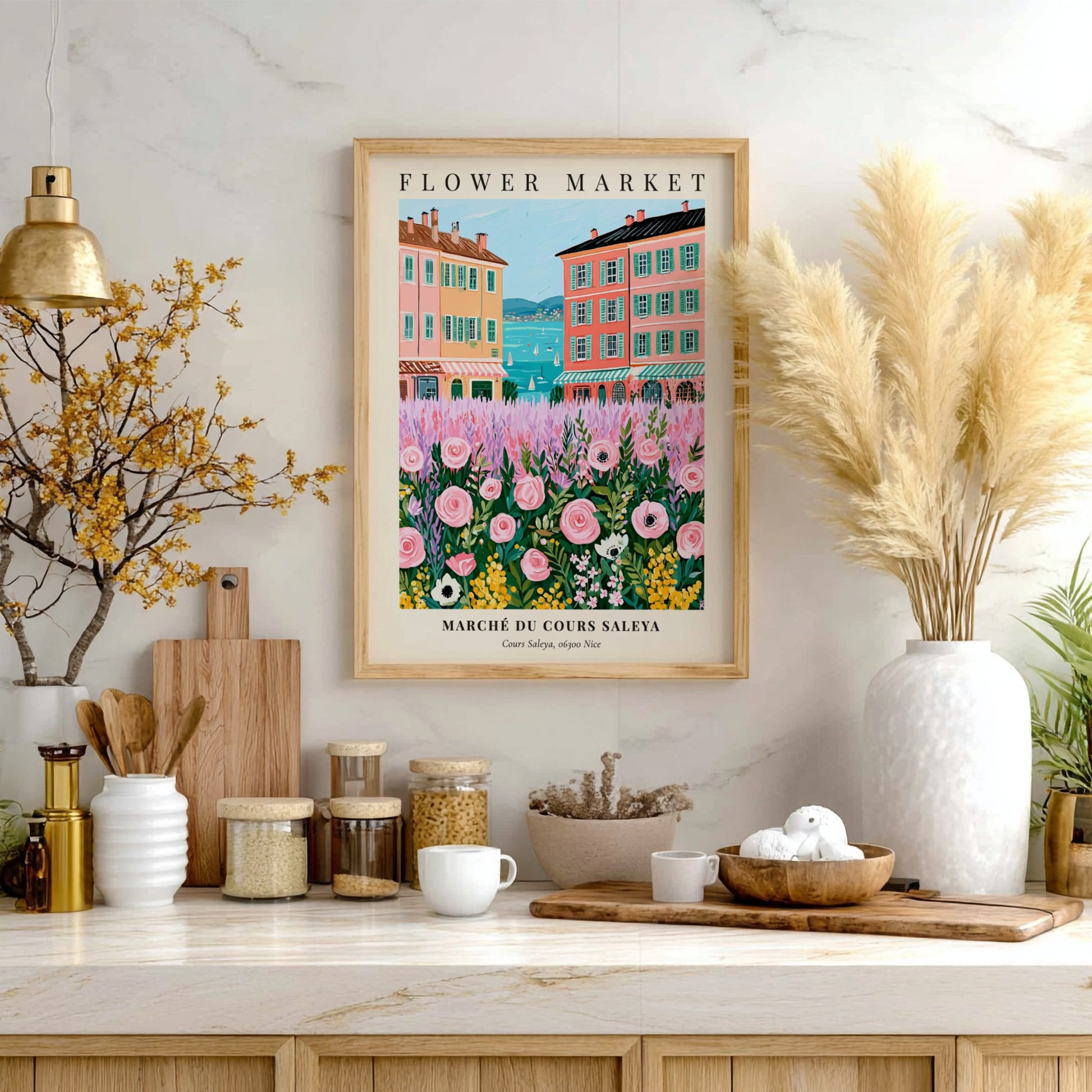 Flower market art print featuring pink flowers and colorful buildings by the sea in a whimsical style