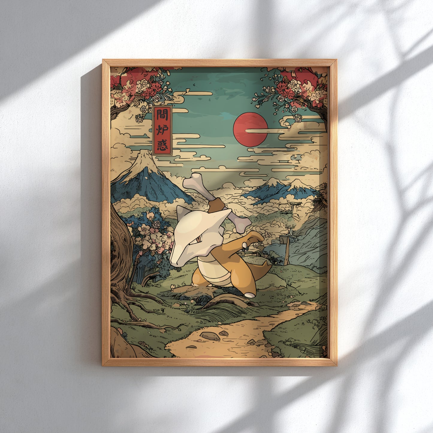 Framed artwork of Marowak Pokemon and Mount Fuji with cherry blossoms and a red sun.
