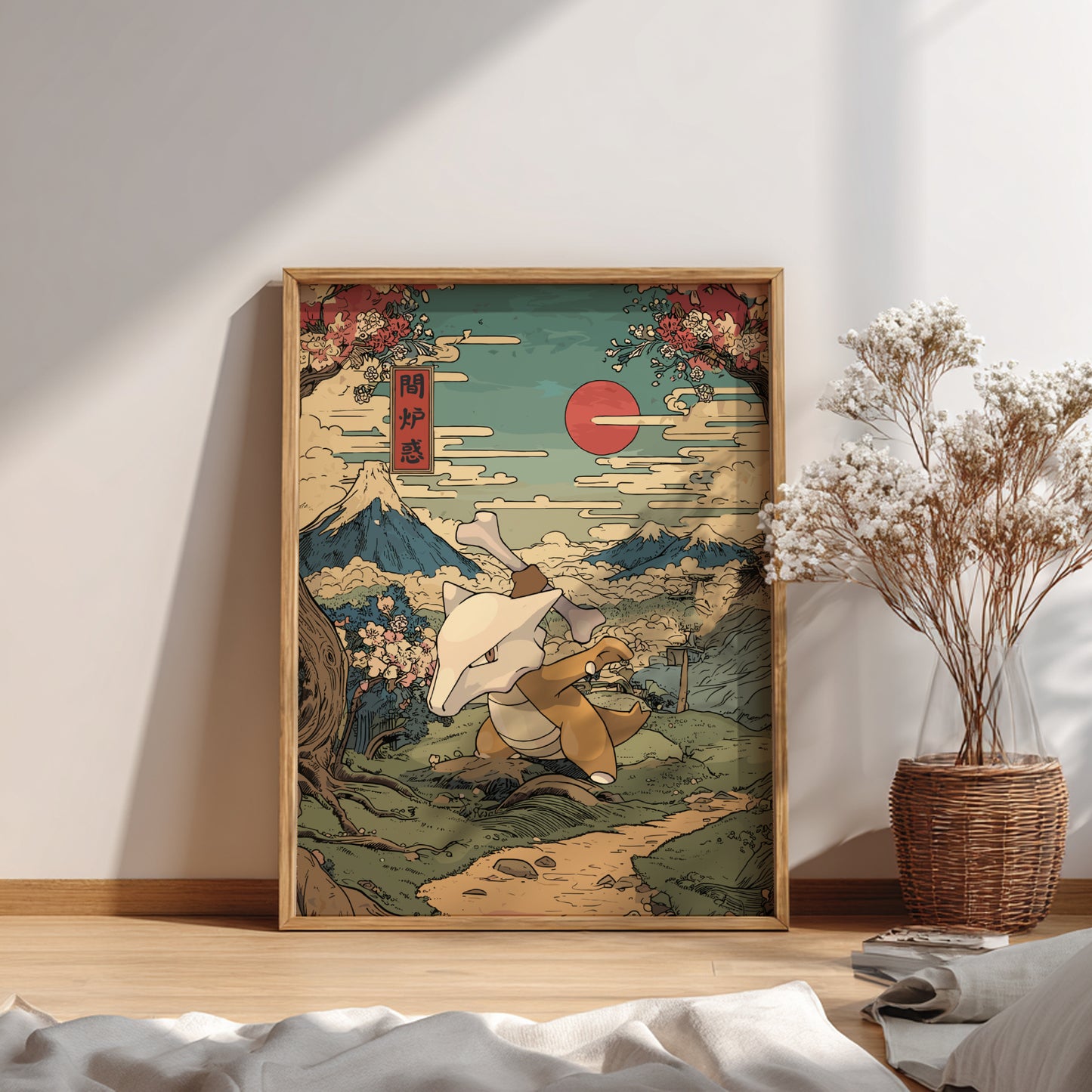 Framed artwork of a traditional Japanese scene with Mount Fuji and Marowak Pokemon on a wall in a room.