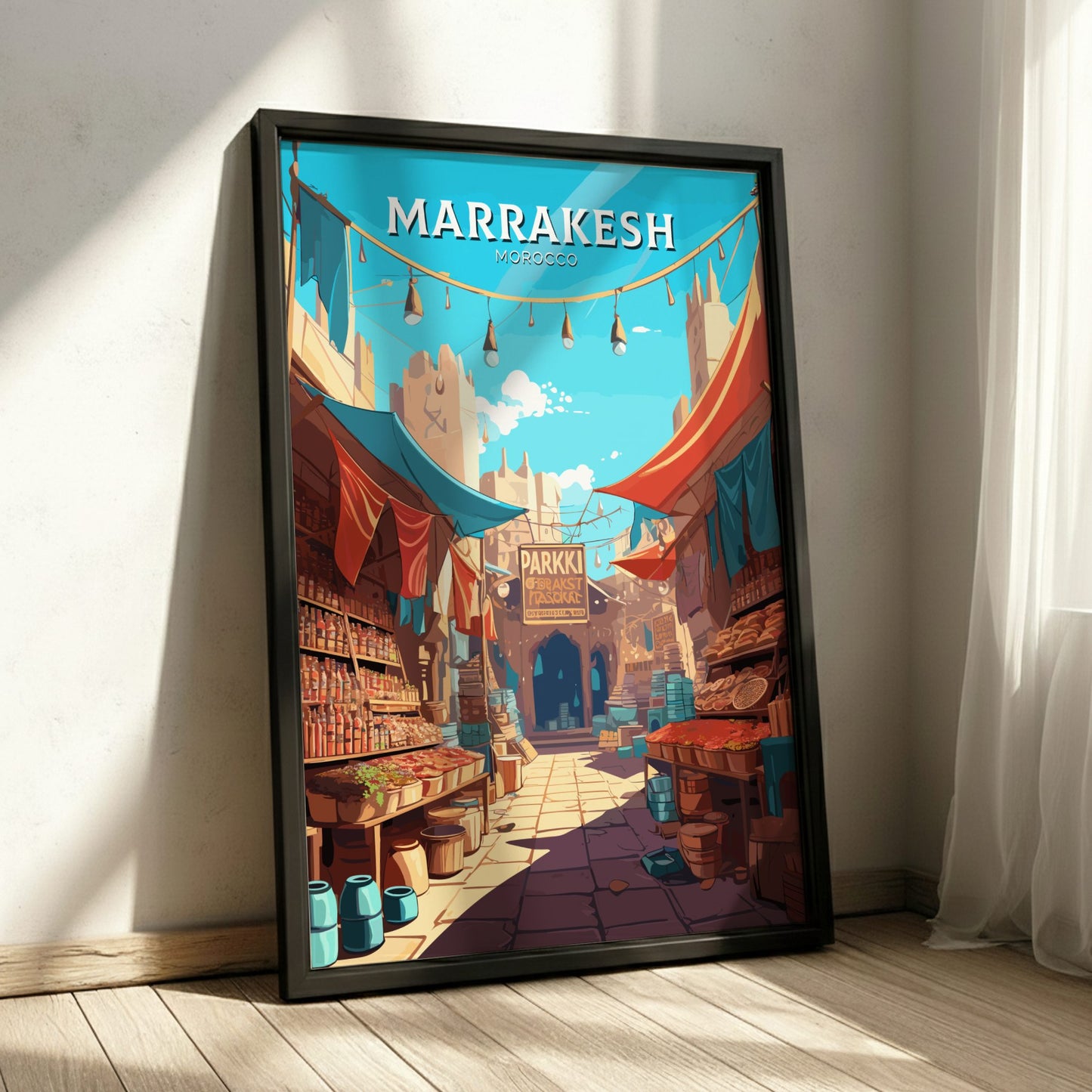 Framed artwork of a colorful street scene in Marrakesh, Morocco, on a white wall.