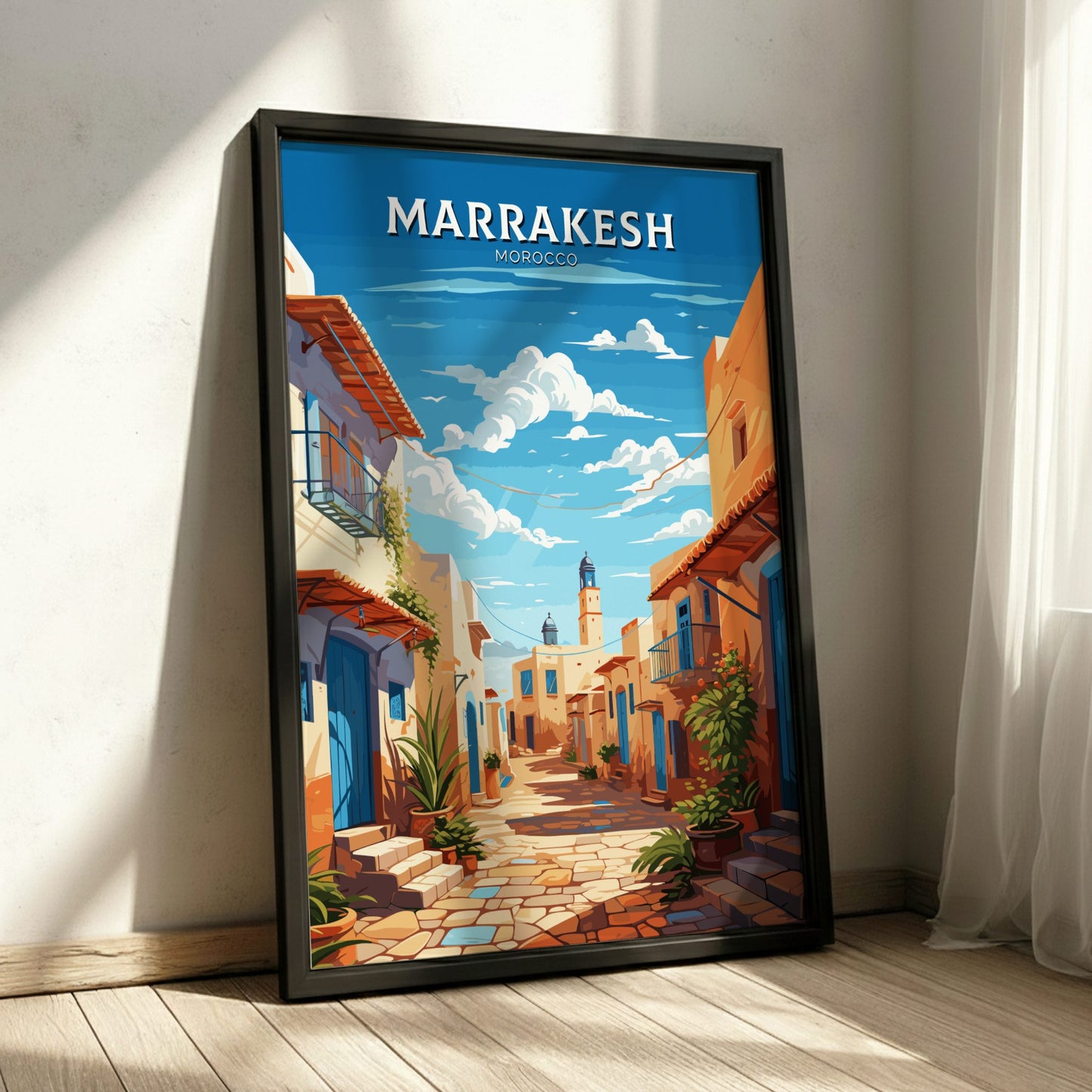 Framed artwork of a street scene in Marrakesh, Morocco on a wall.