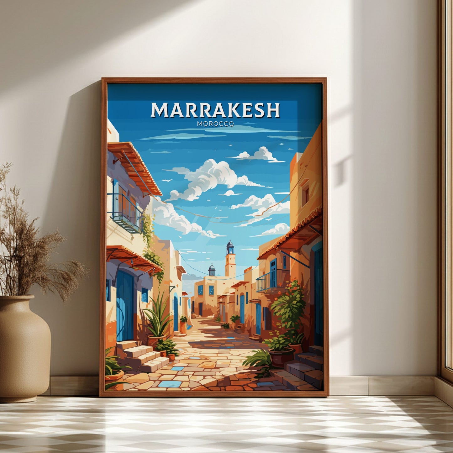 Framed artwork of a street scene in Marrakesh with 'Marrakesh' text on a blue sky background.