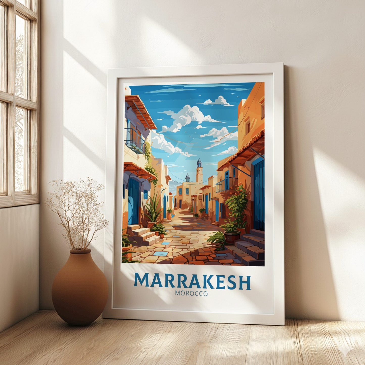 Framed artwork of Marrakesh, Morocco with a street scene and 'Marrakesh Morocco' text.