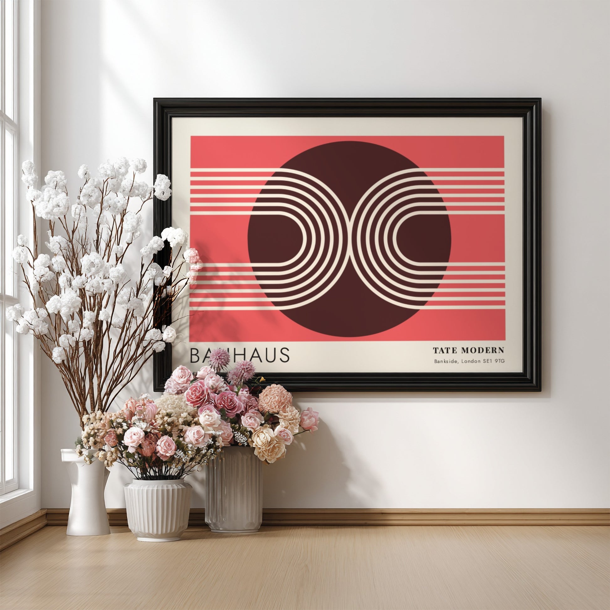 Bauhaus Tate Modern poster featuring geometric white lines and circular shapes on red.