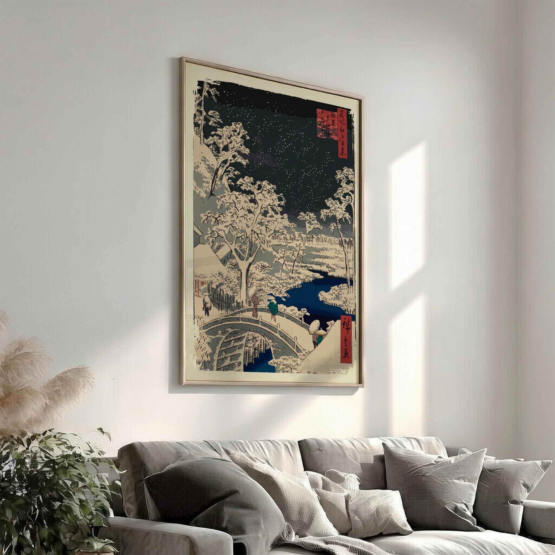 Japanese woodblock print poster of a snowy night scene with a bridge, trees, and stars.