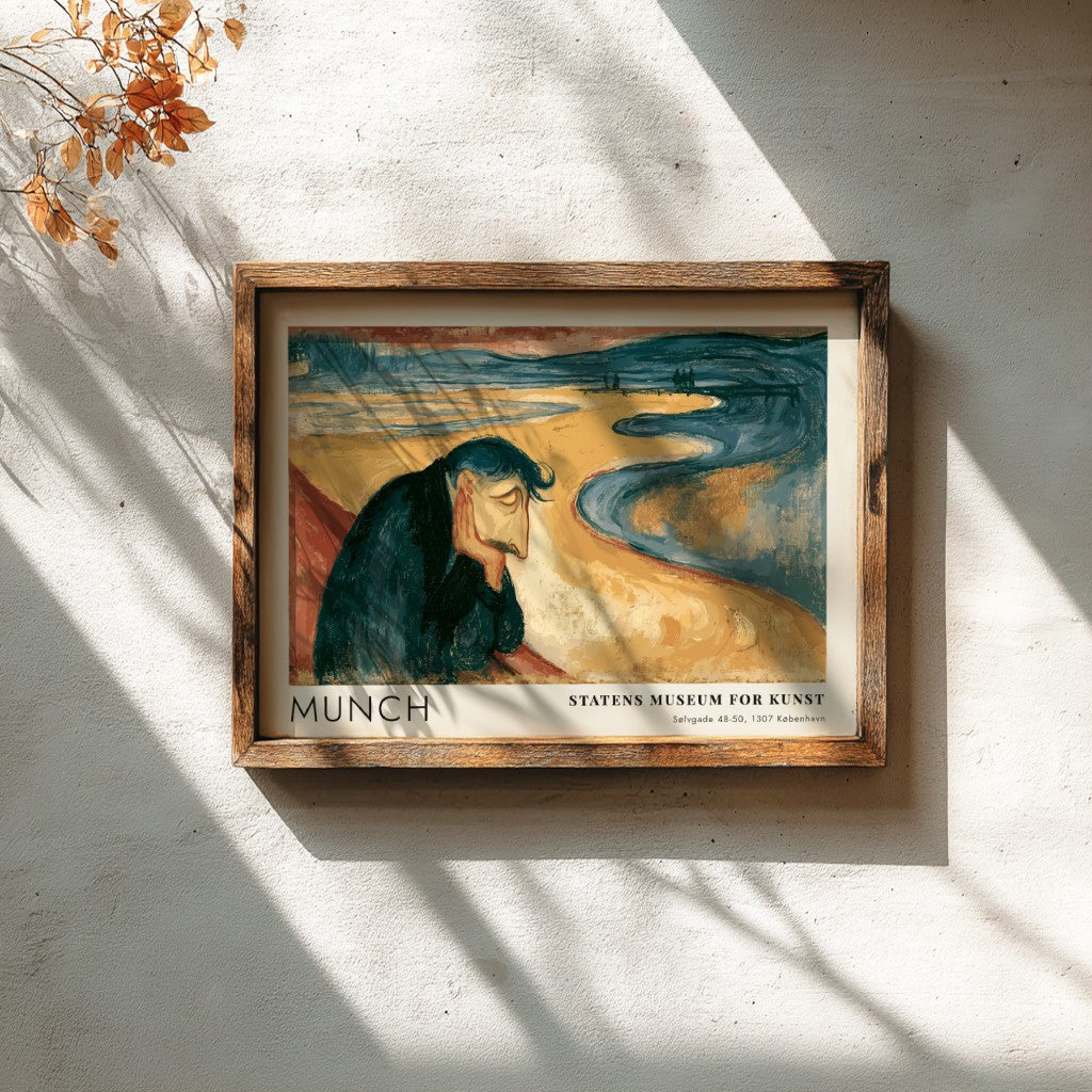 Framed Munch Melancholy exhibition print featuring a pensive man on a golden beach.