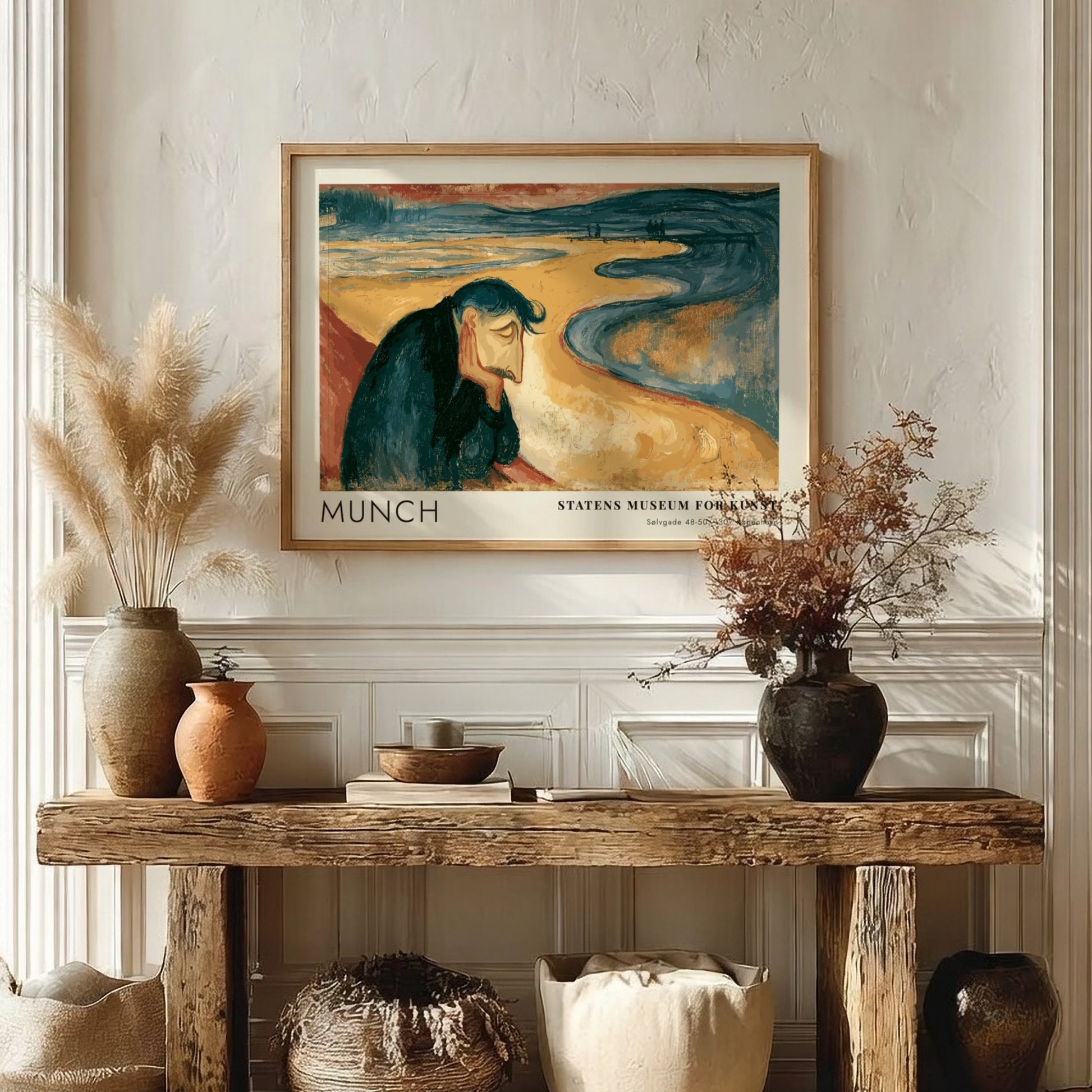 Framed Munch Melancholy exhibition print featuring a pensive man on a golden beach.