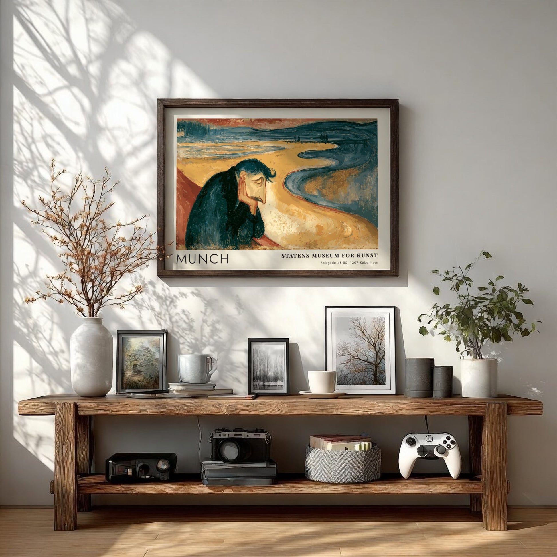 Framed Munch Melancholy exhibition print featuring a pensive man on a golden beach.