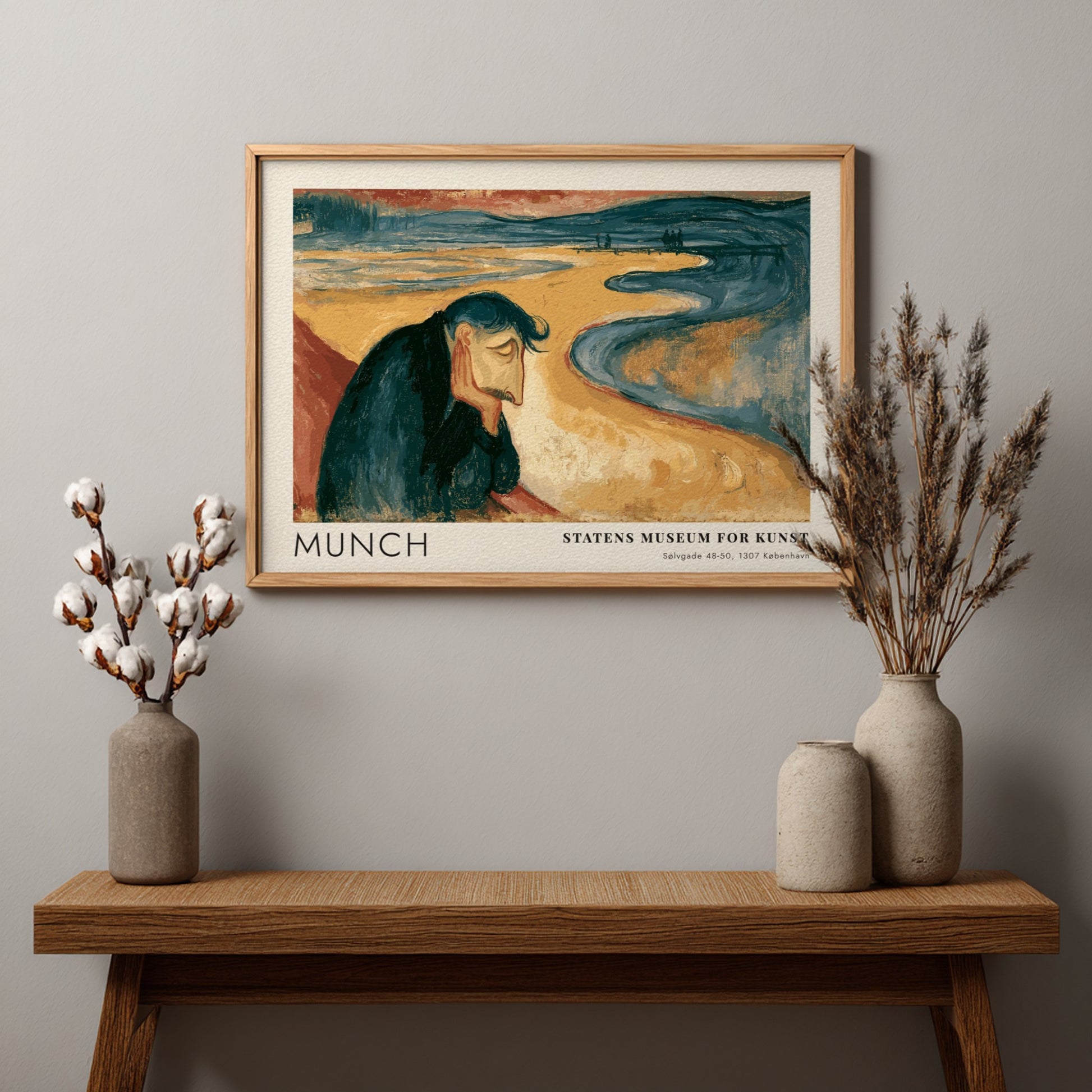 Framed Munch Melancholy exhibition print featuring a pensive man on a golden beach.