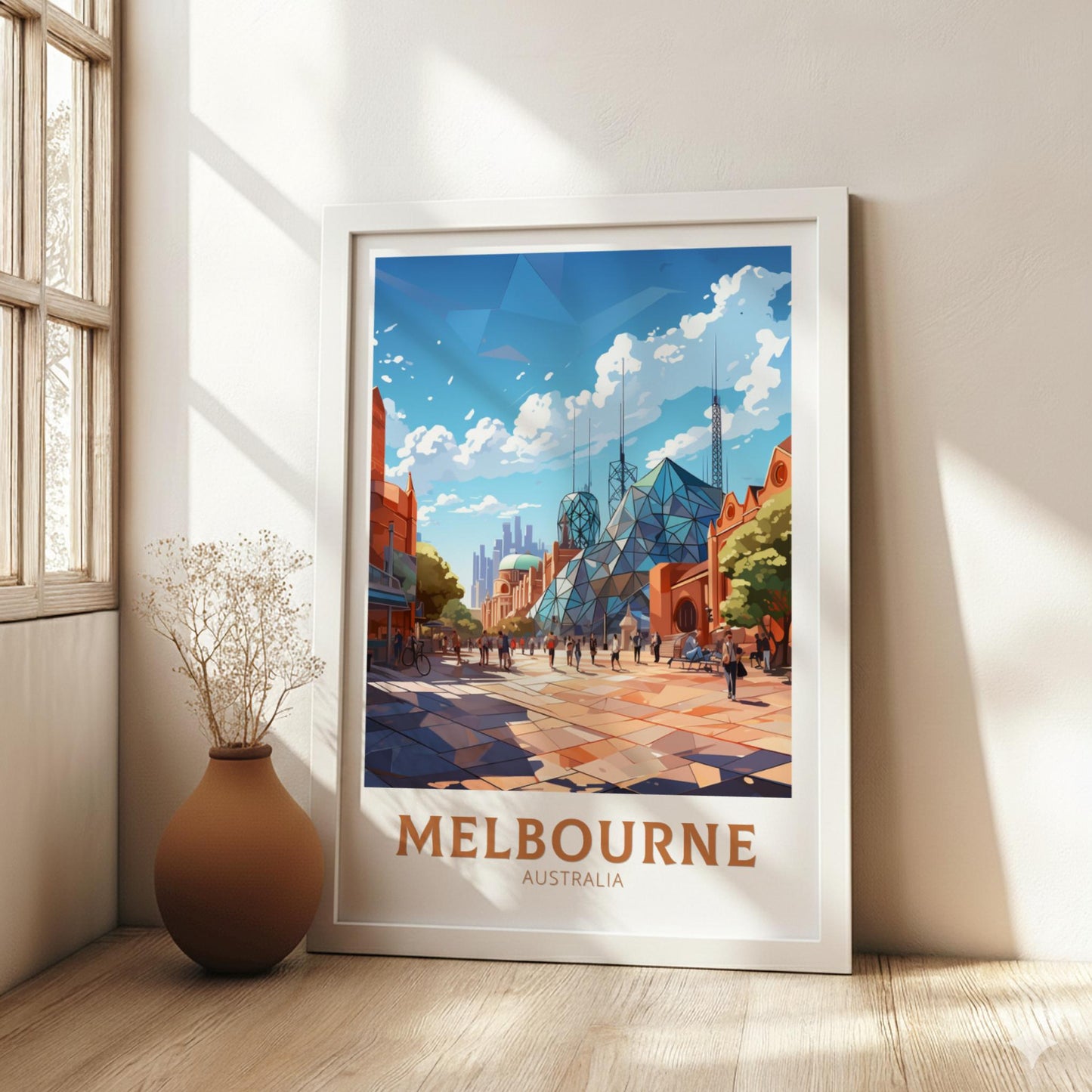 Framed artwork of Melbourne, Australia on a wall in a bright room with a vase.