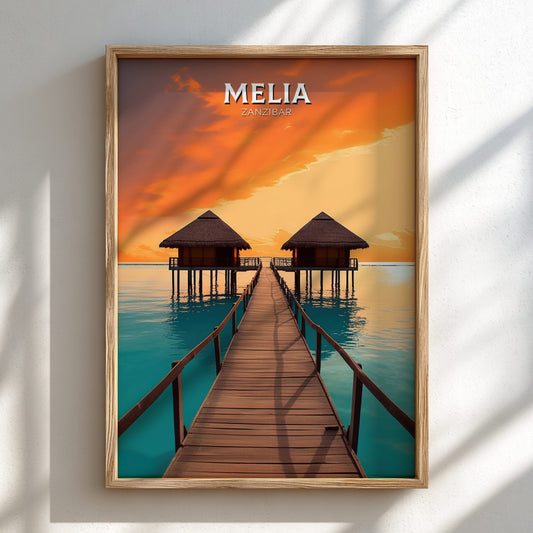 Framed artwork of a sunset over water with huts and a dock, featuring the brand 'Melia'.