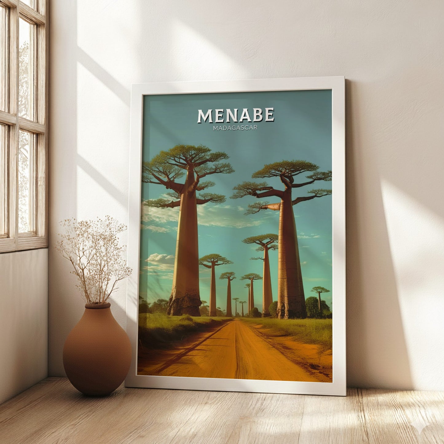 Framed artwork of baobab trees in Menabe, Madagascar, on a wall in a bright room.