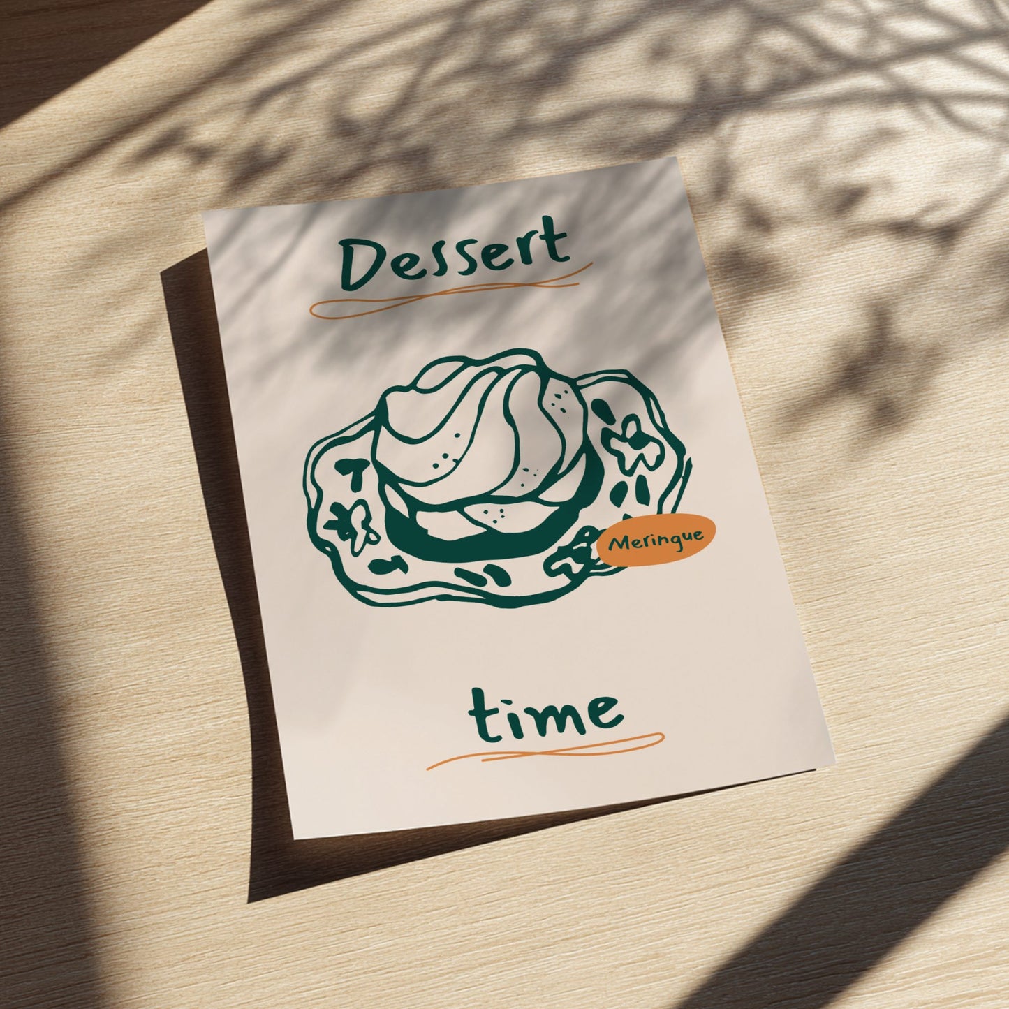 Notebook with a dessert illustration and text on a wooden surface