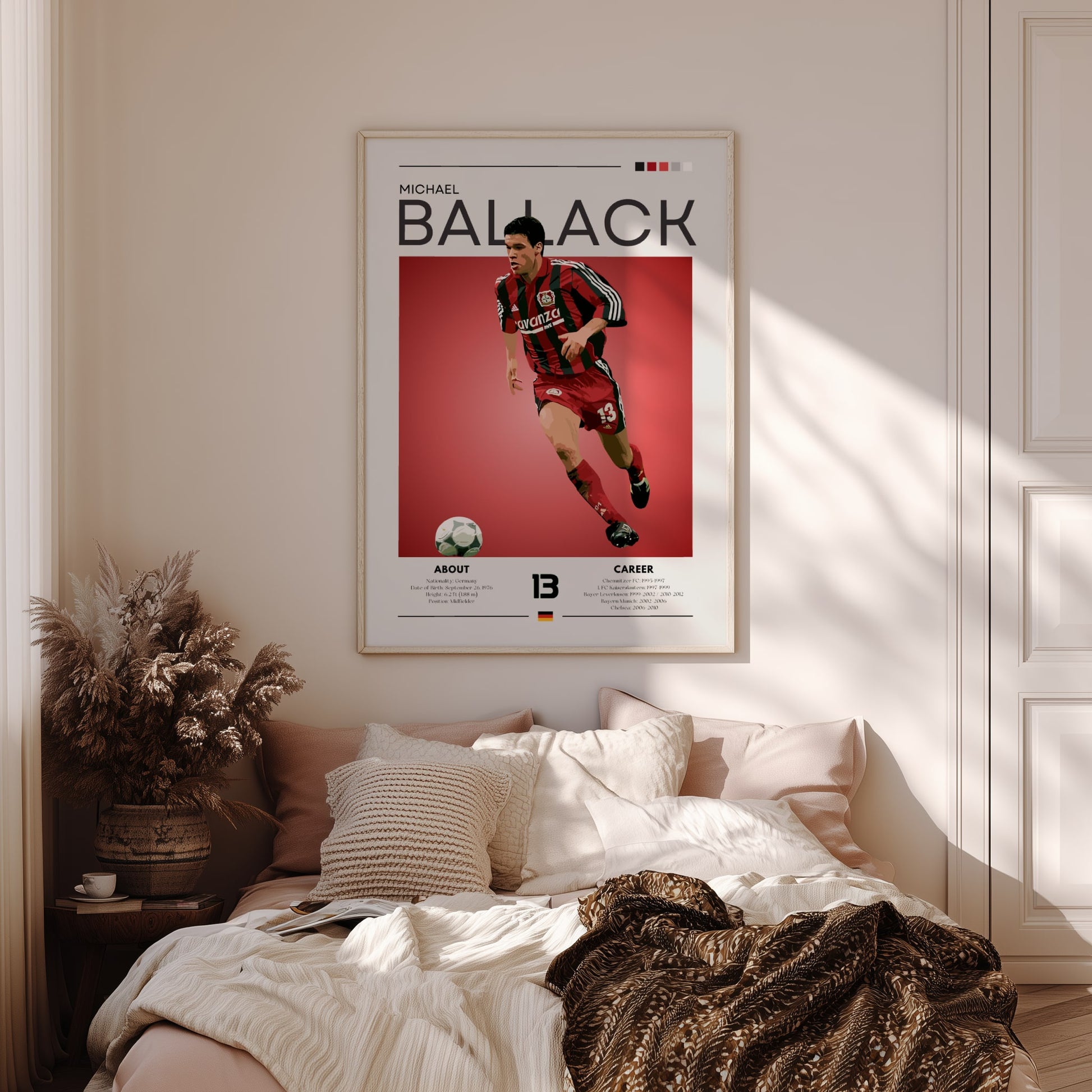 Poster of a soccer player on the wall above a bed in a bedroom