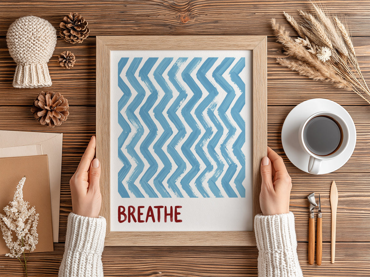 Motivational poster featuring blue hand-painted zigzag stripes above the word Breathe in red.