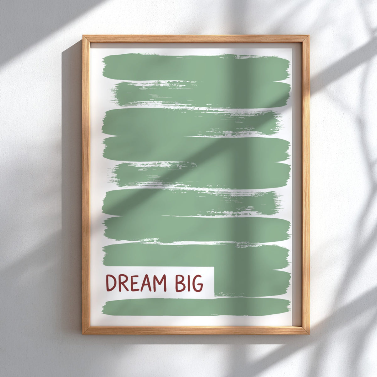 Motivational poster with dark Dream Big text over layered sage green brushstroke background.