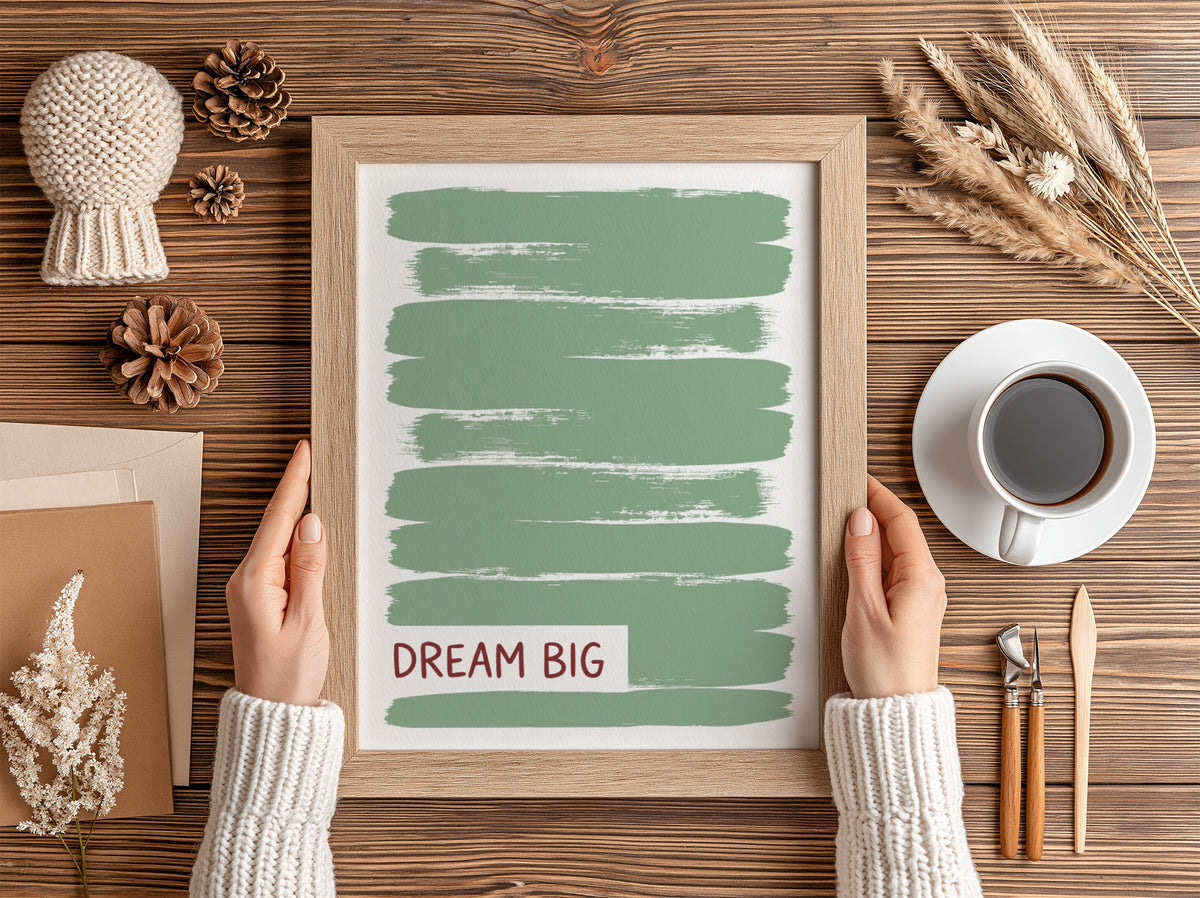 Motivational poster with dark Dream Big text over layered sage green brushstroke background.